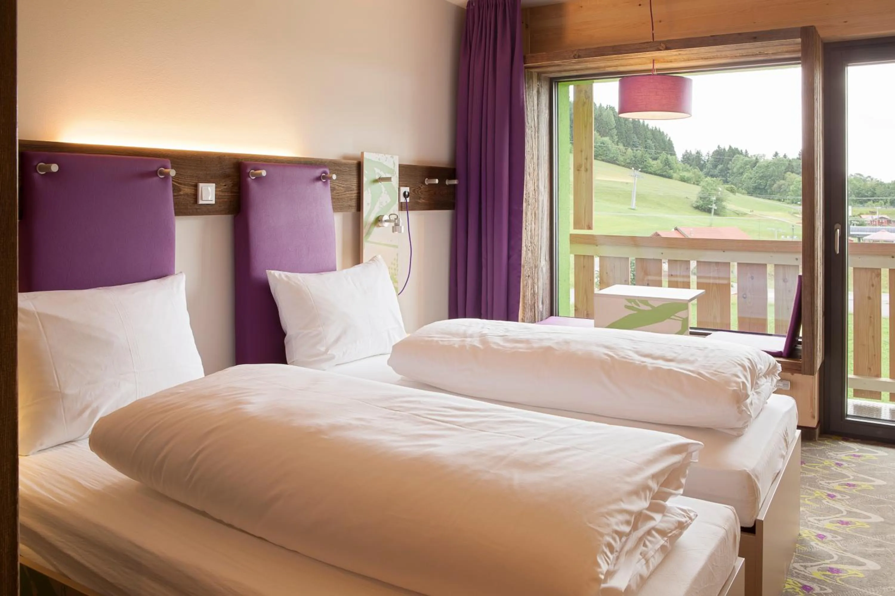 Photo of the whole room, Bed in Explorer Hotel Montafon