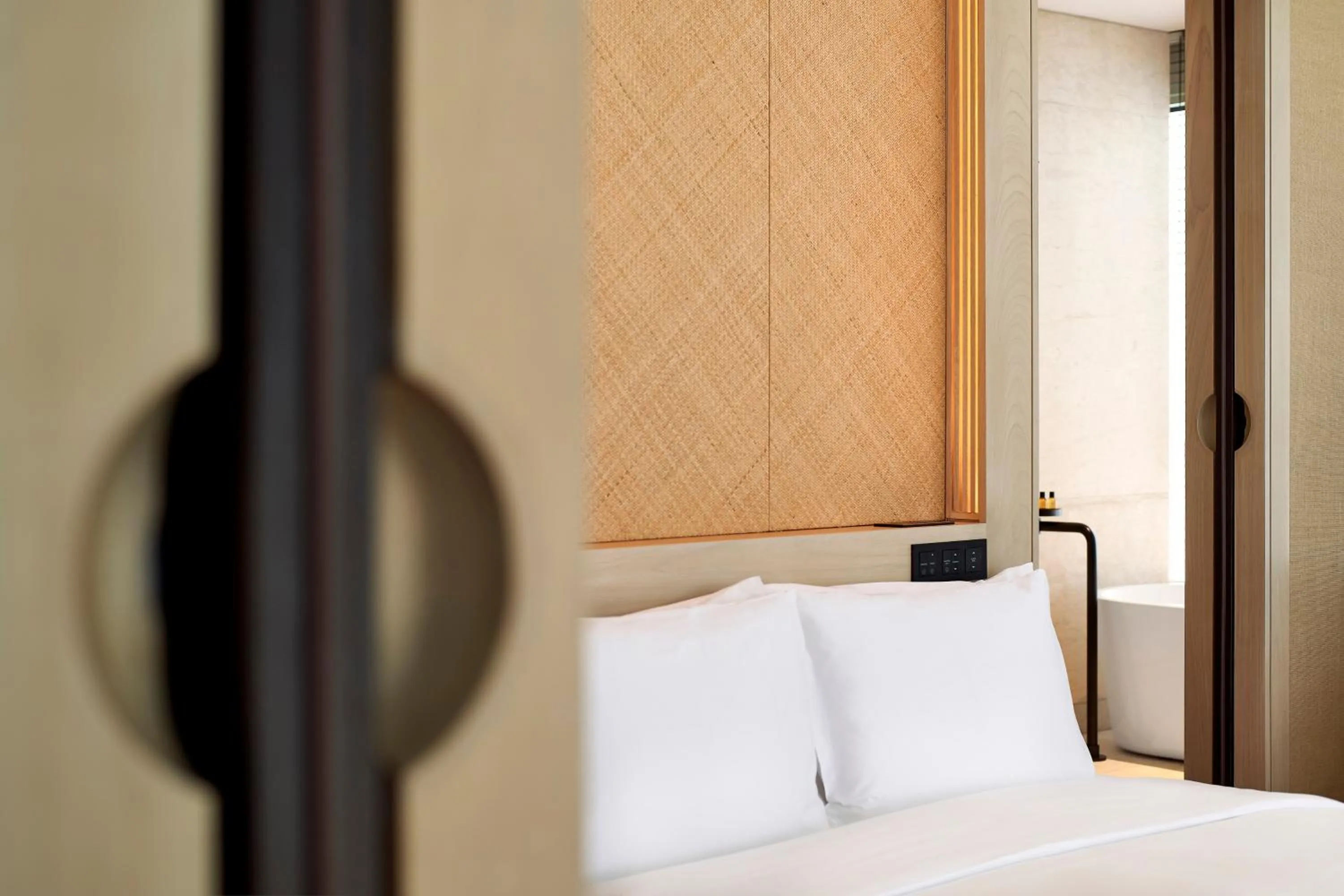 Bed in The RuMa Hotel and Residences