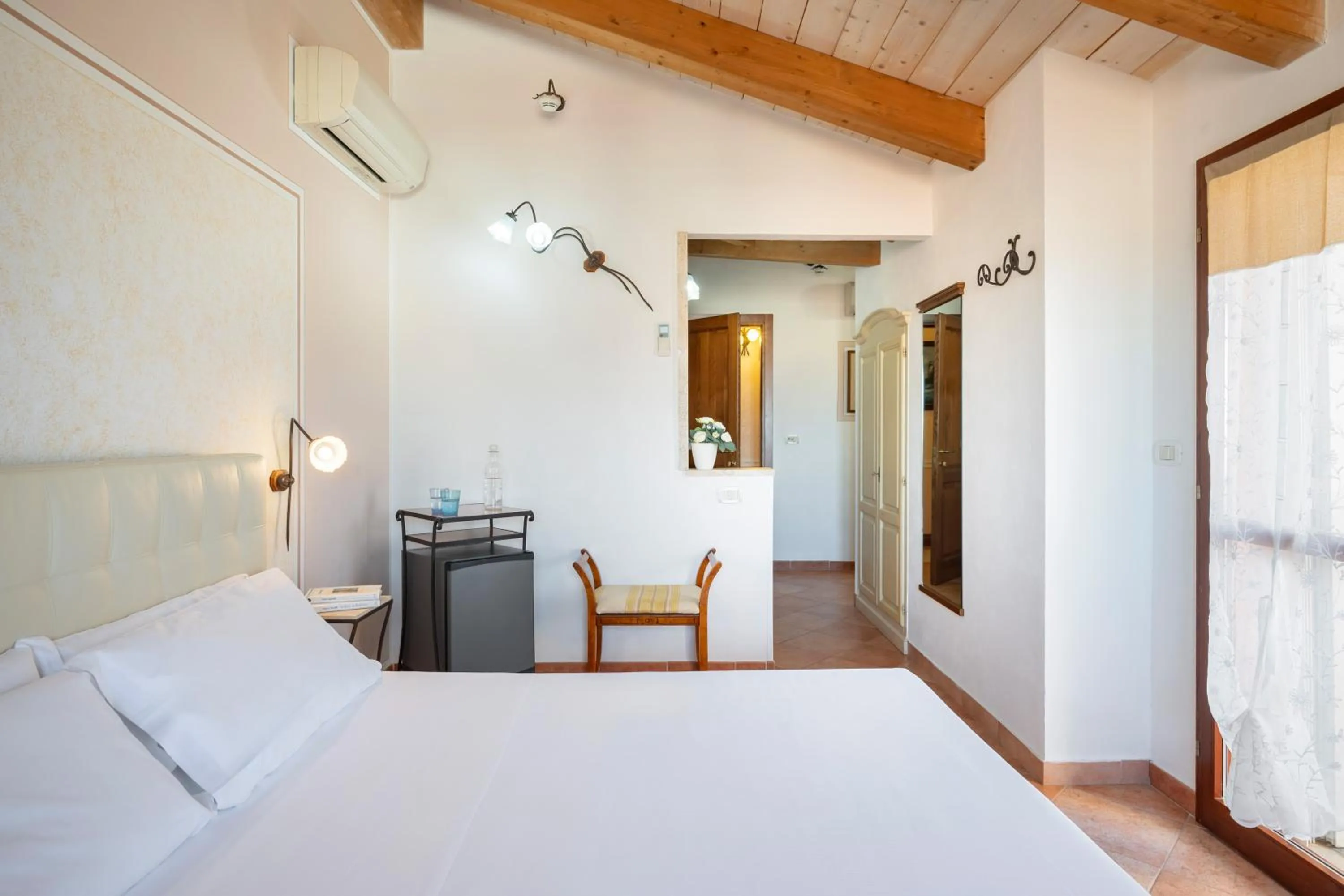 Bedroom in Lola Piccolo Hotel e Appartamenti