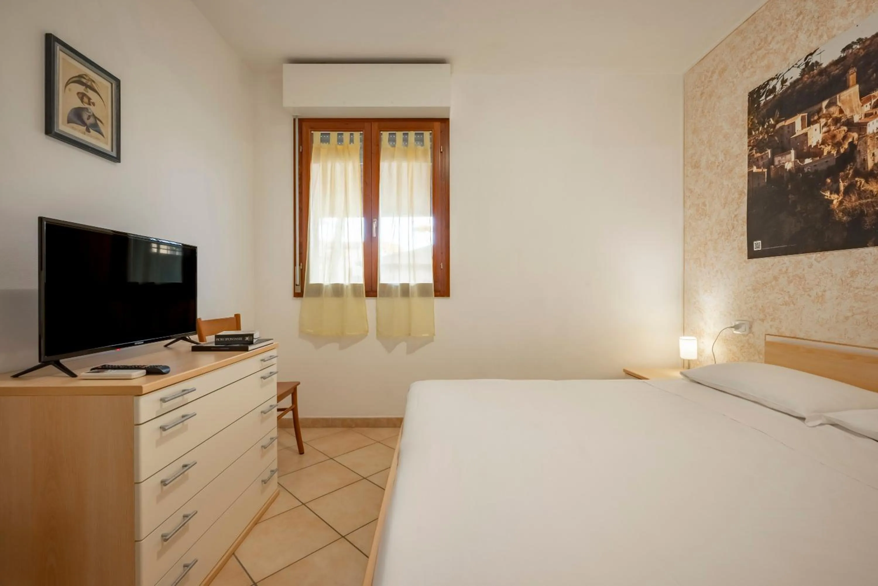 Bedroom in Lola Piccolo Hotel e Appartamenti