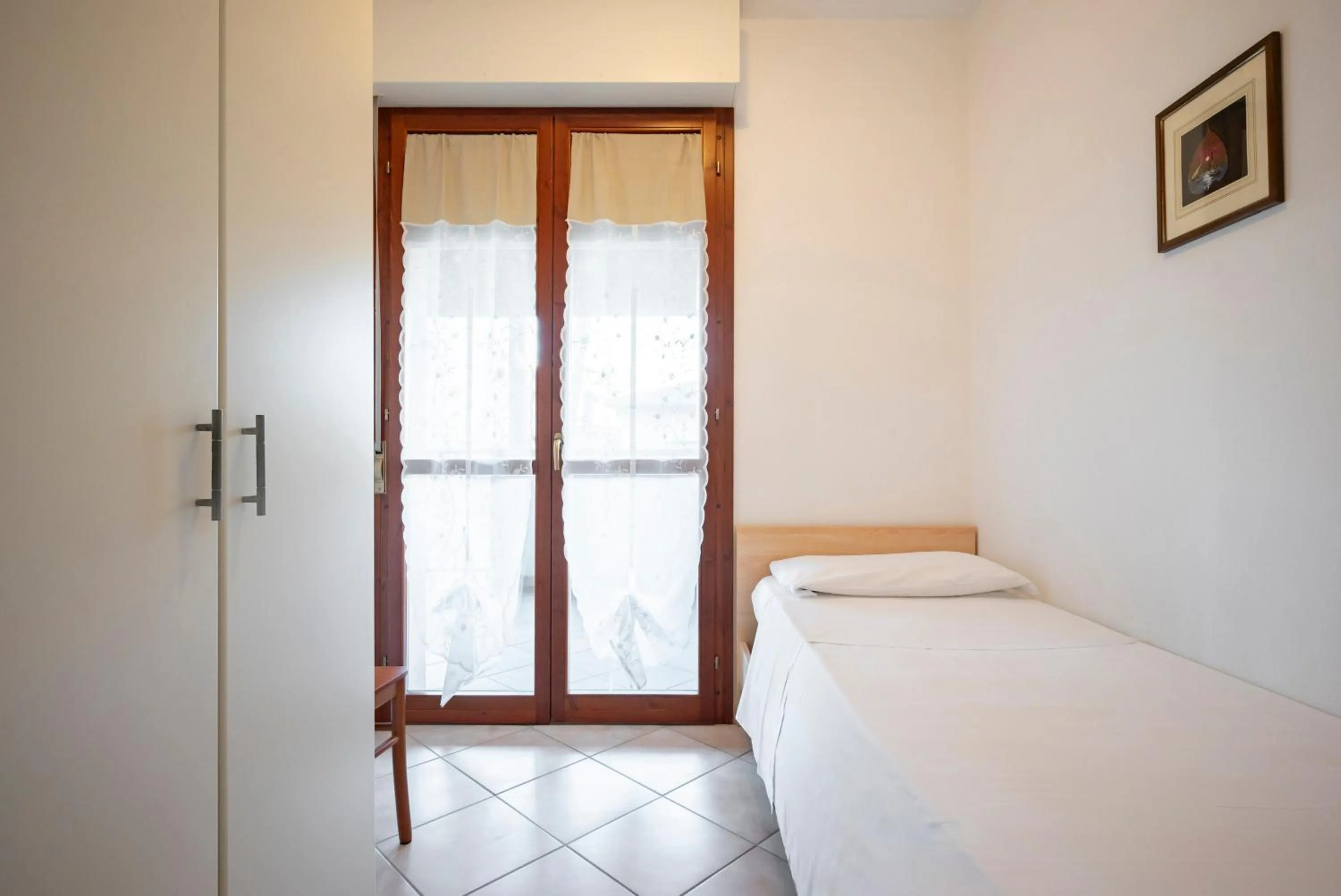 Bedroom in Lola Piccolo Hotel e Appartamenti