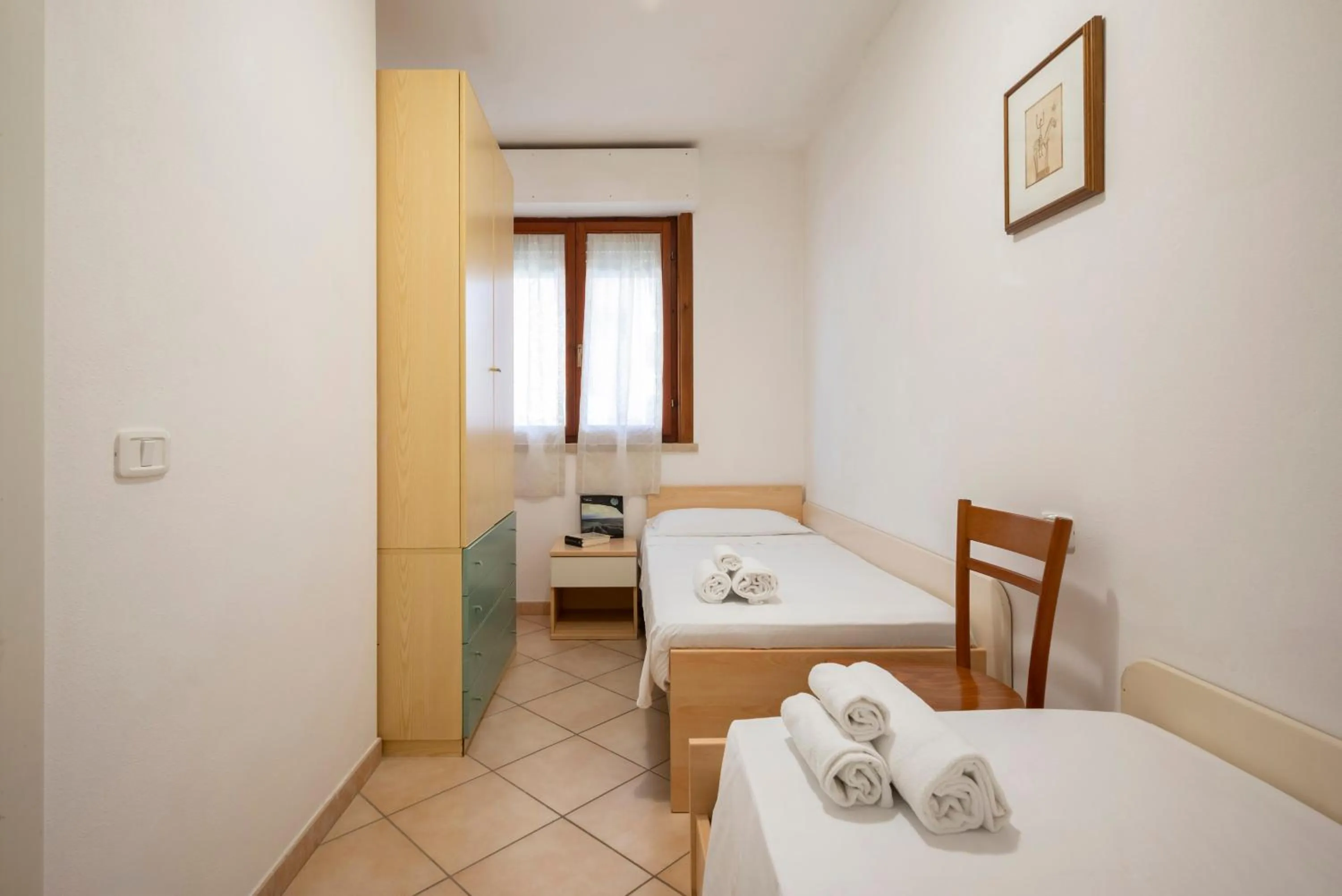 Bedroom in Lola Piccolo Hotel e Appartamenti