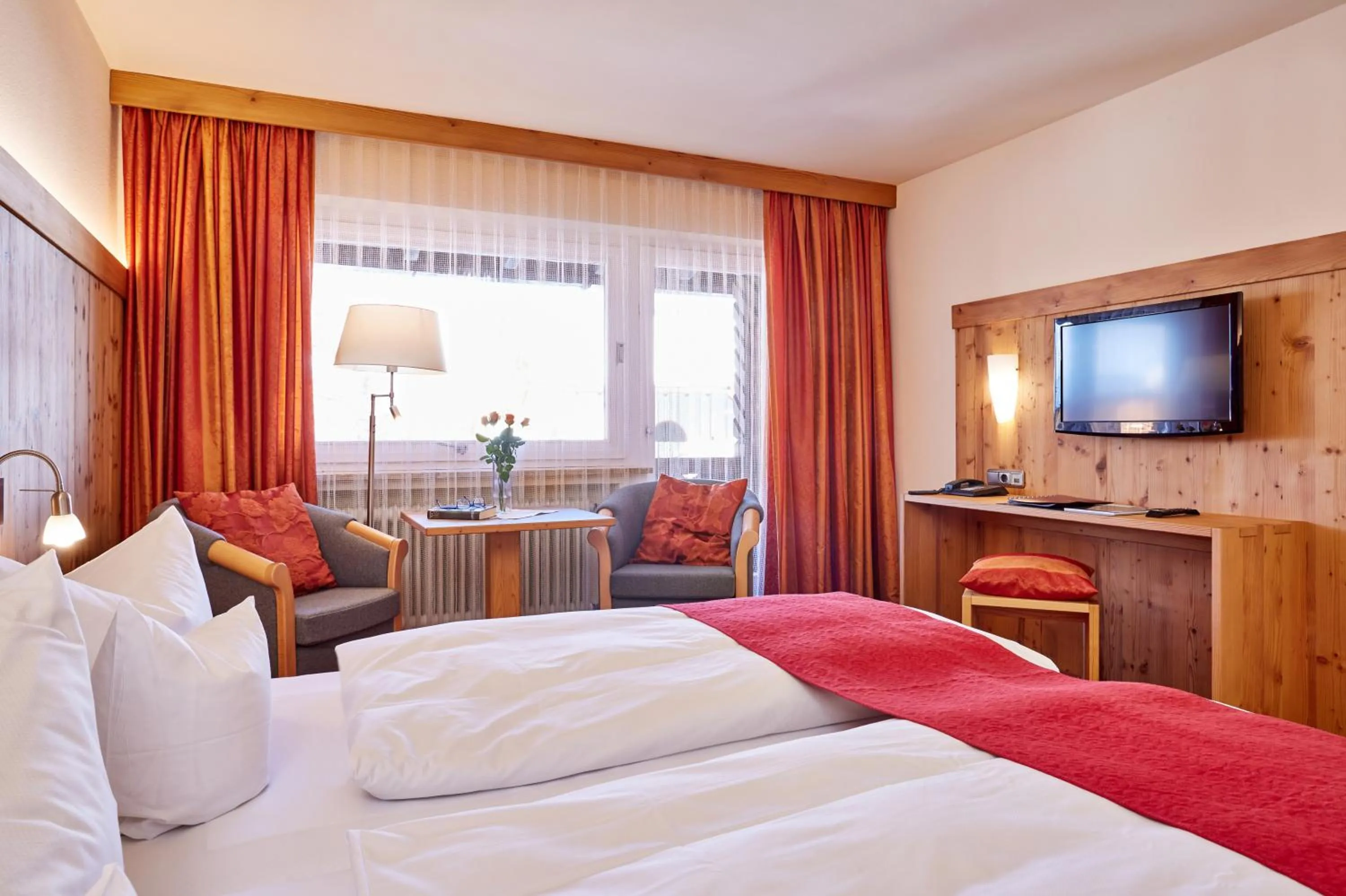 Seating area, Bed in Hotel Franziska