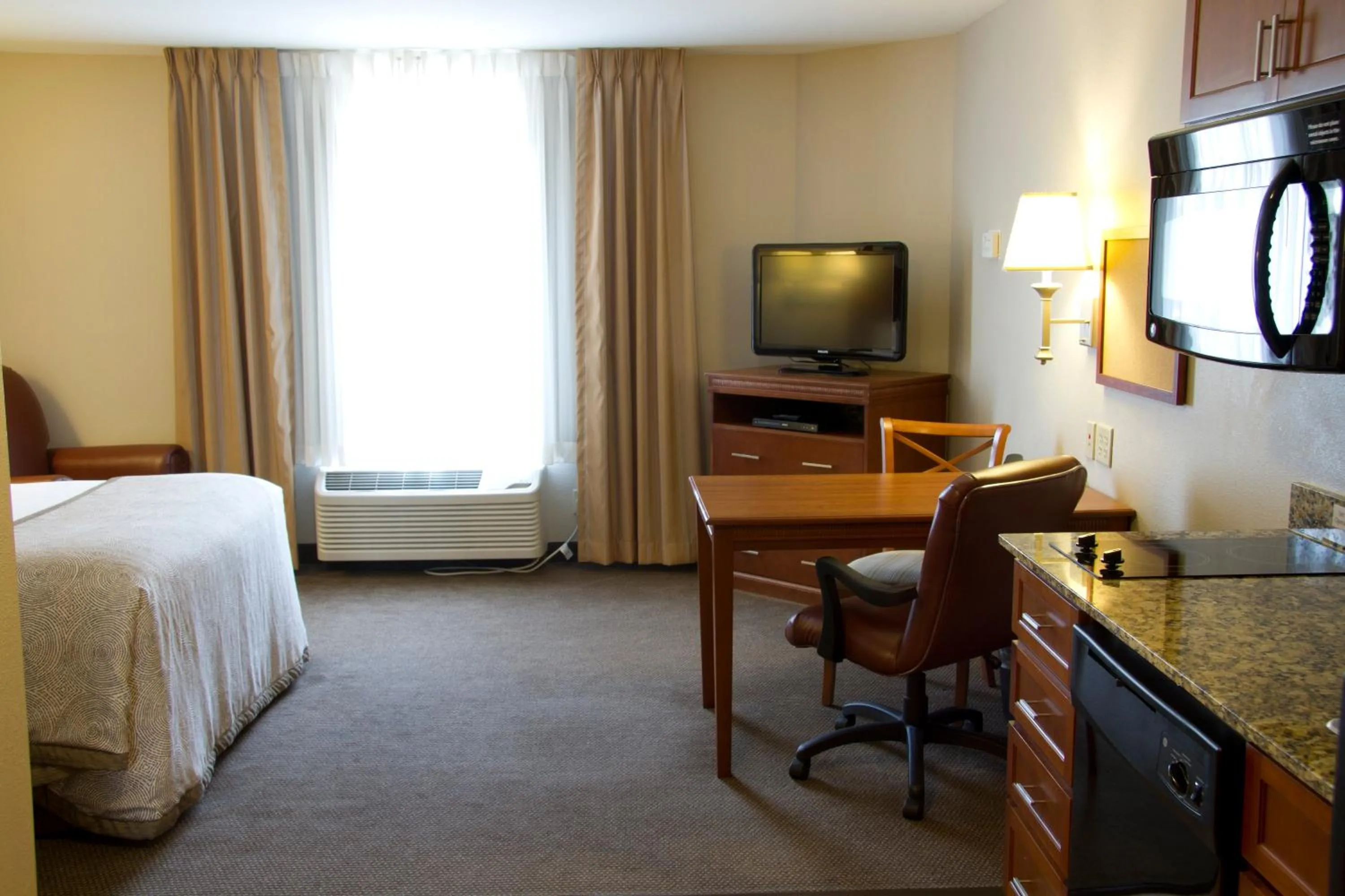Photo of the whole room, Bed in Candlewood Suites Champaign-Urbana University Area by IHG