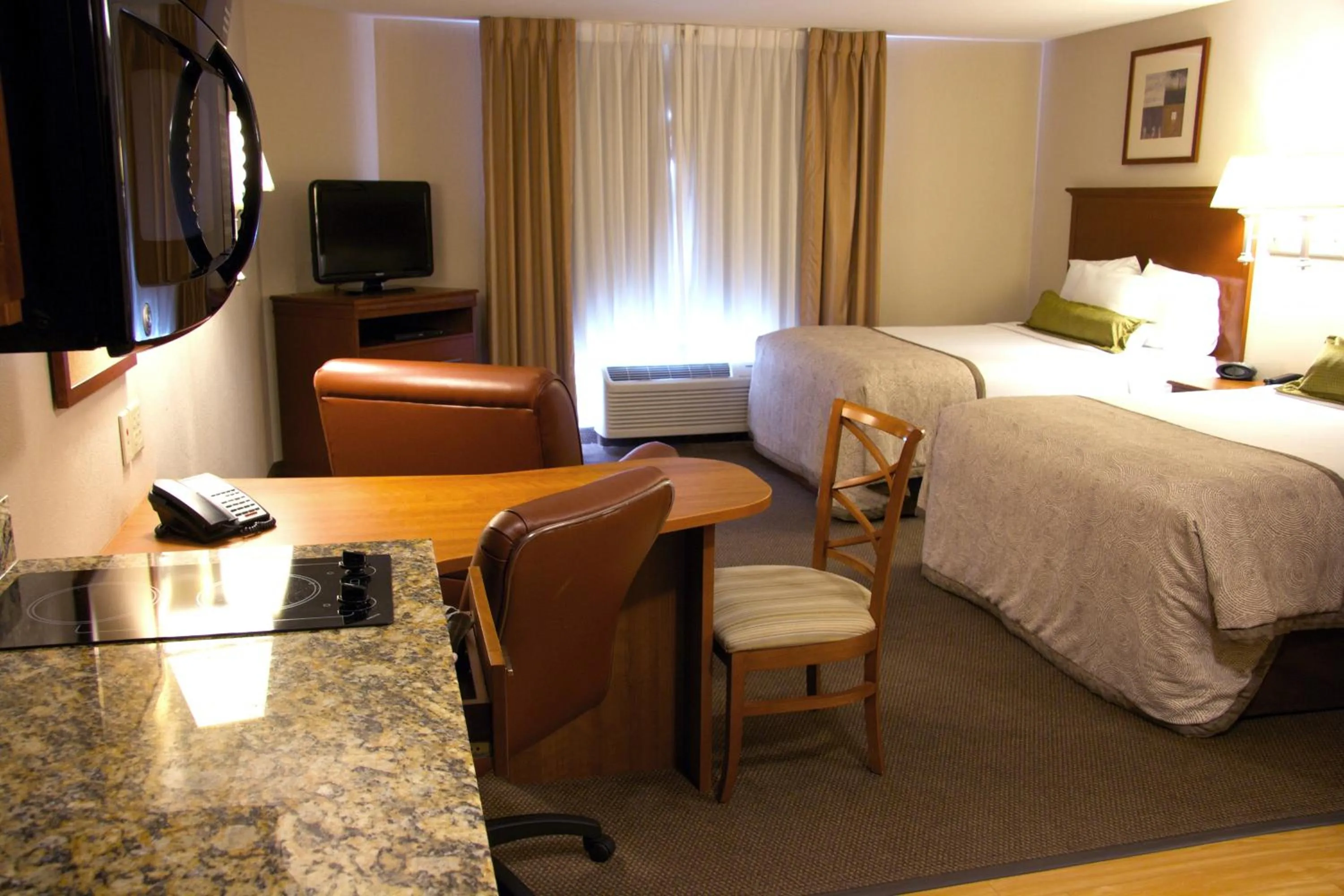 Photo of the whole room, Bed in Candlewood Suites Champaign-Urbana University Area by IHG