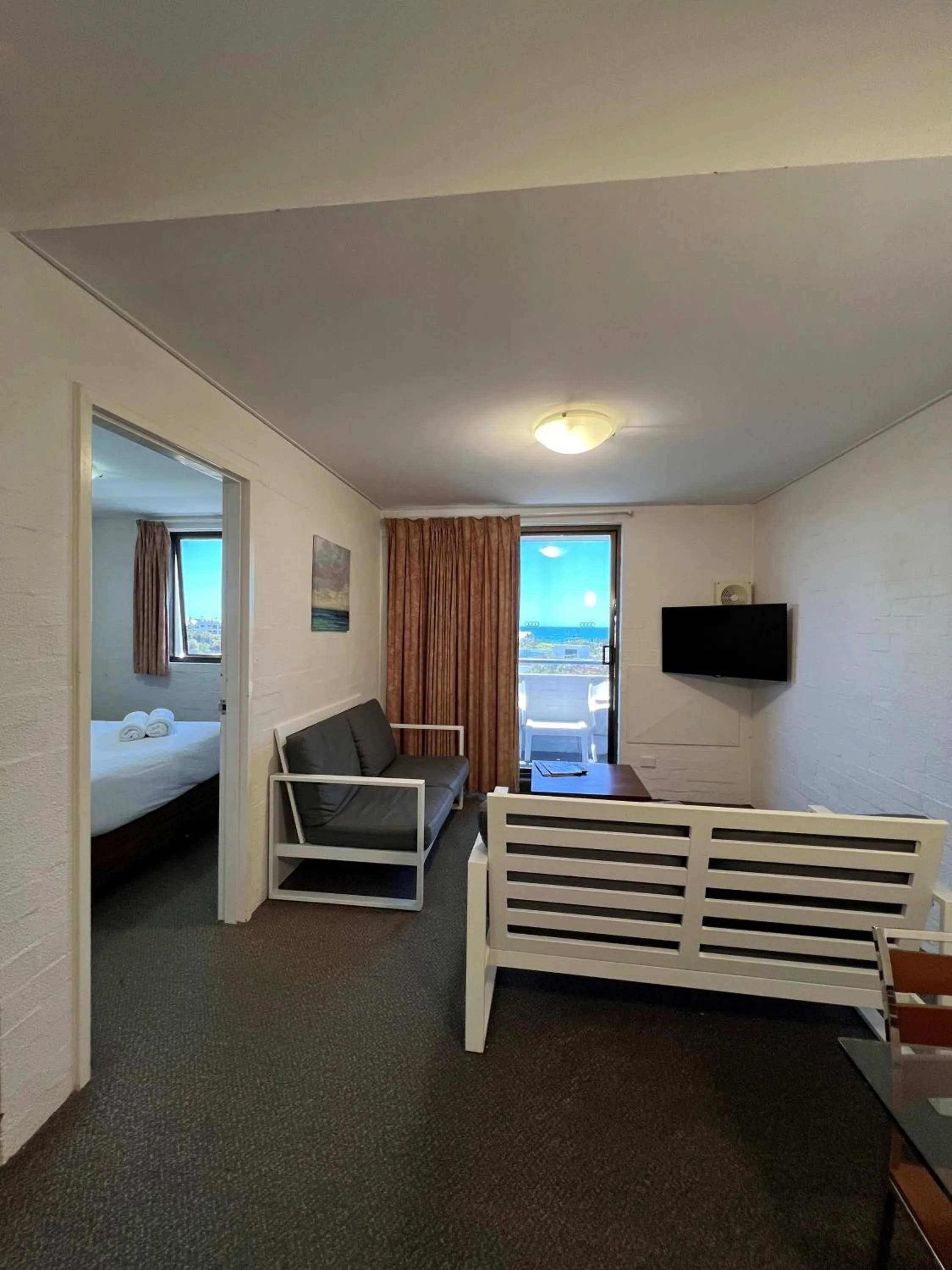 Living room, Bed in Atrium Hotel Mandurah
