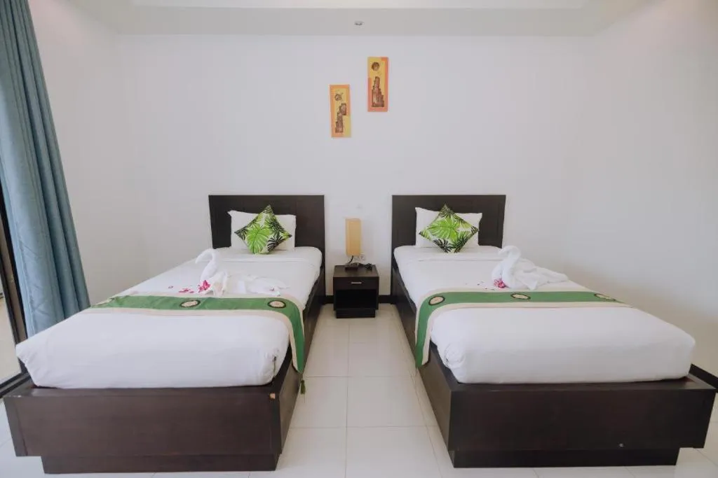 Bed in Phuket Monaburi Boutique Hotel