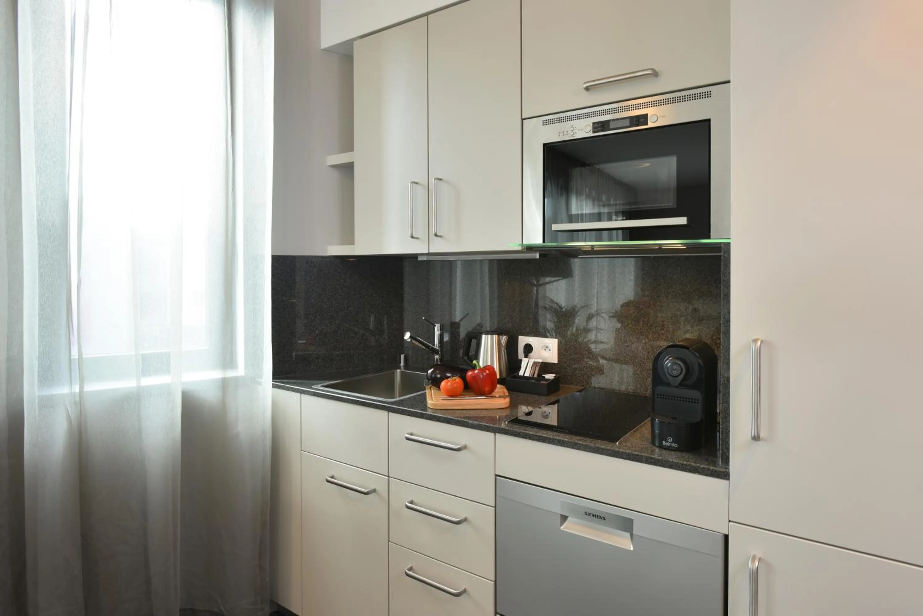 Kitchen or kitchenette in Martin's All Suites