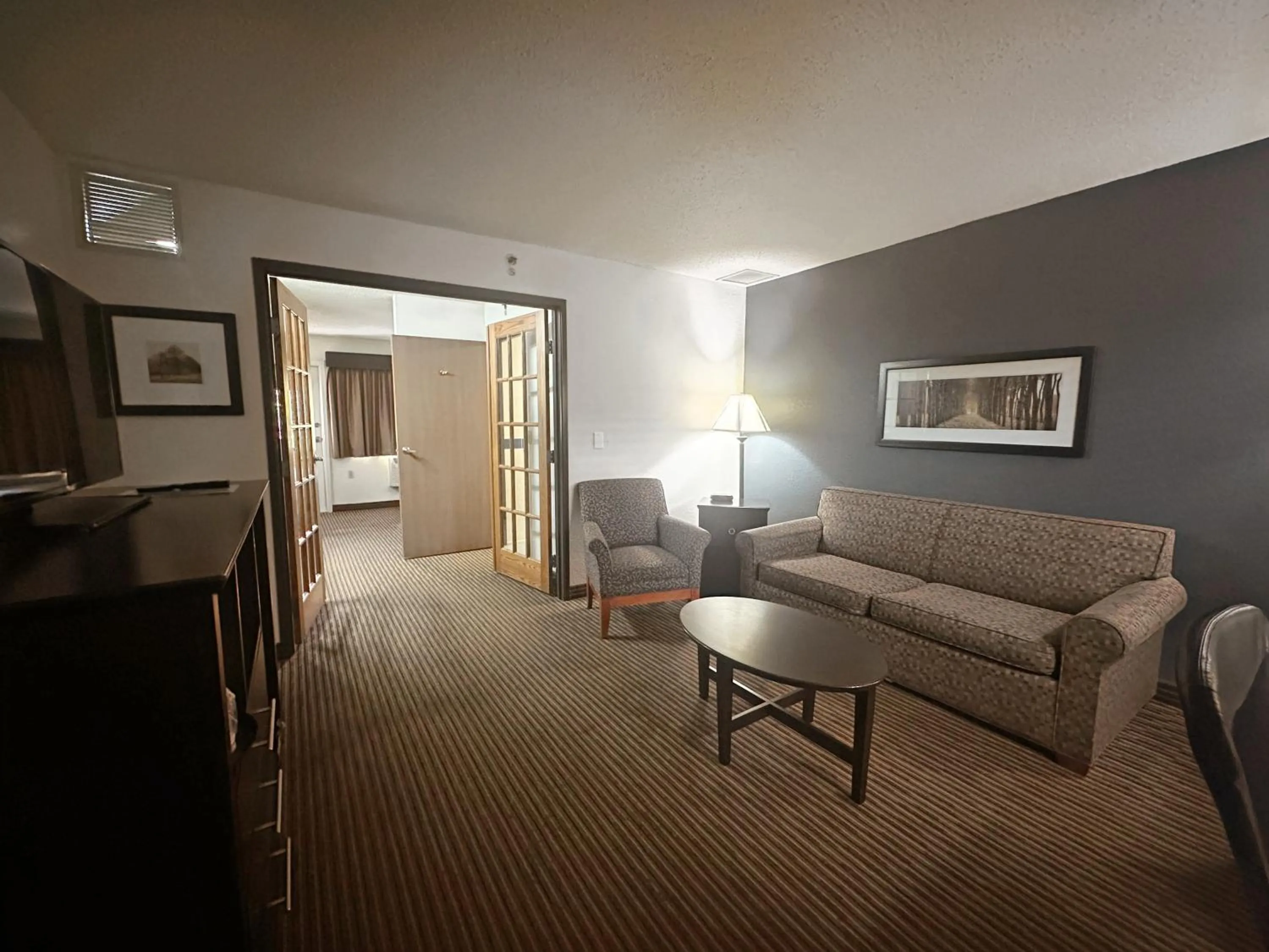 Living room in AmericInn by Wyndham Menominee