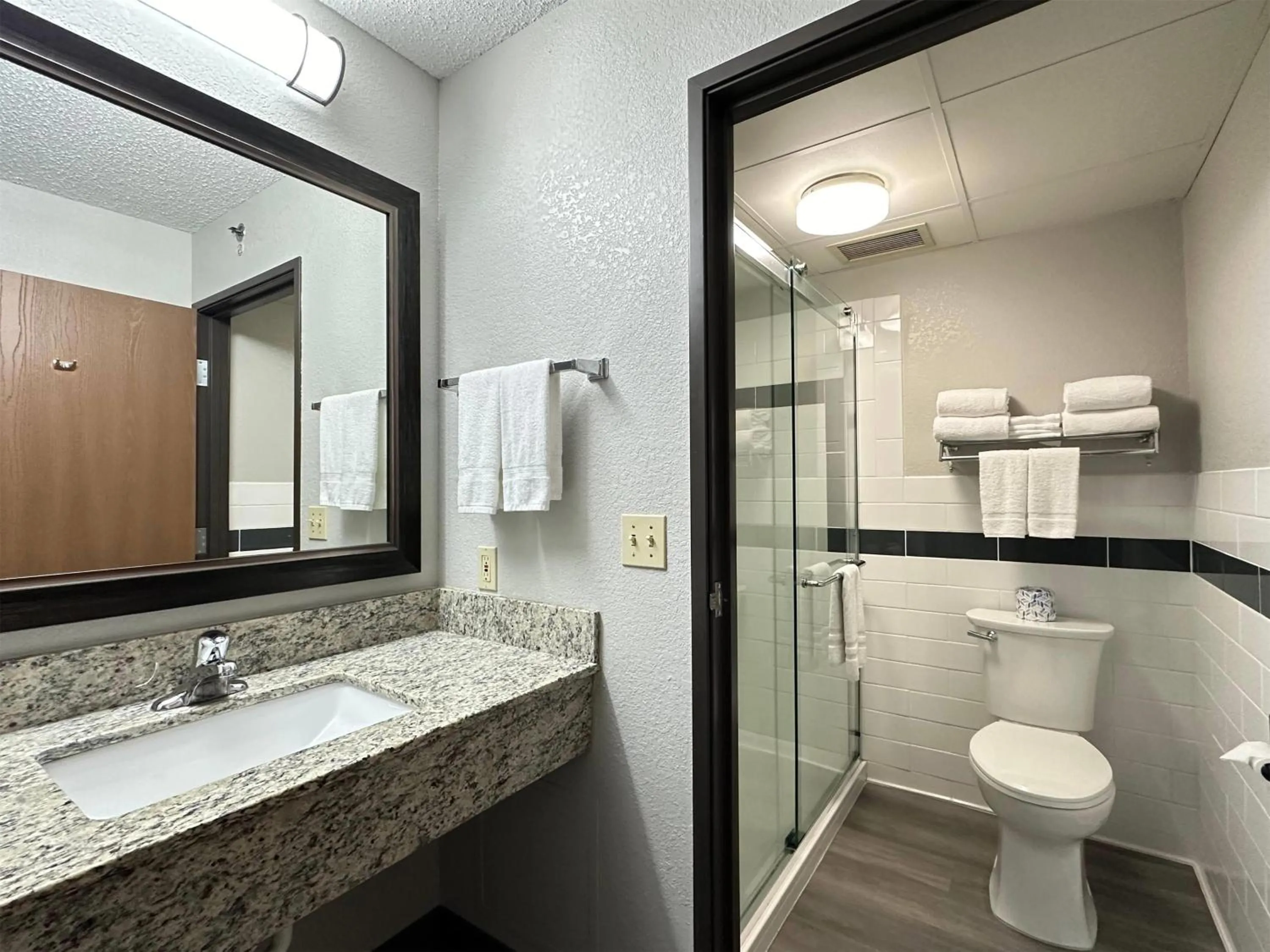 Bathroom in AmericInn by Wyndham Menominee