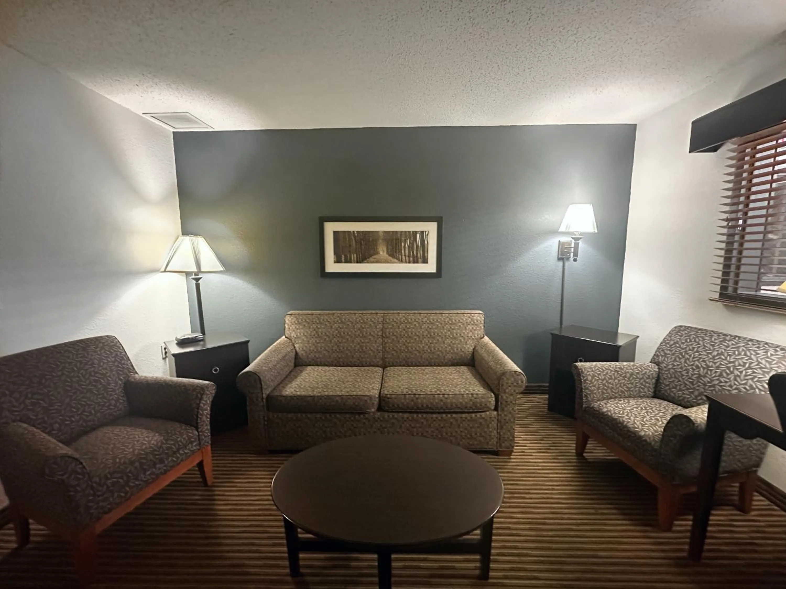 Living room in AmericInn by Wyndham Menominee