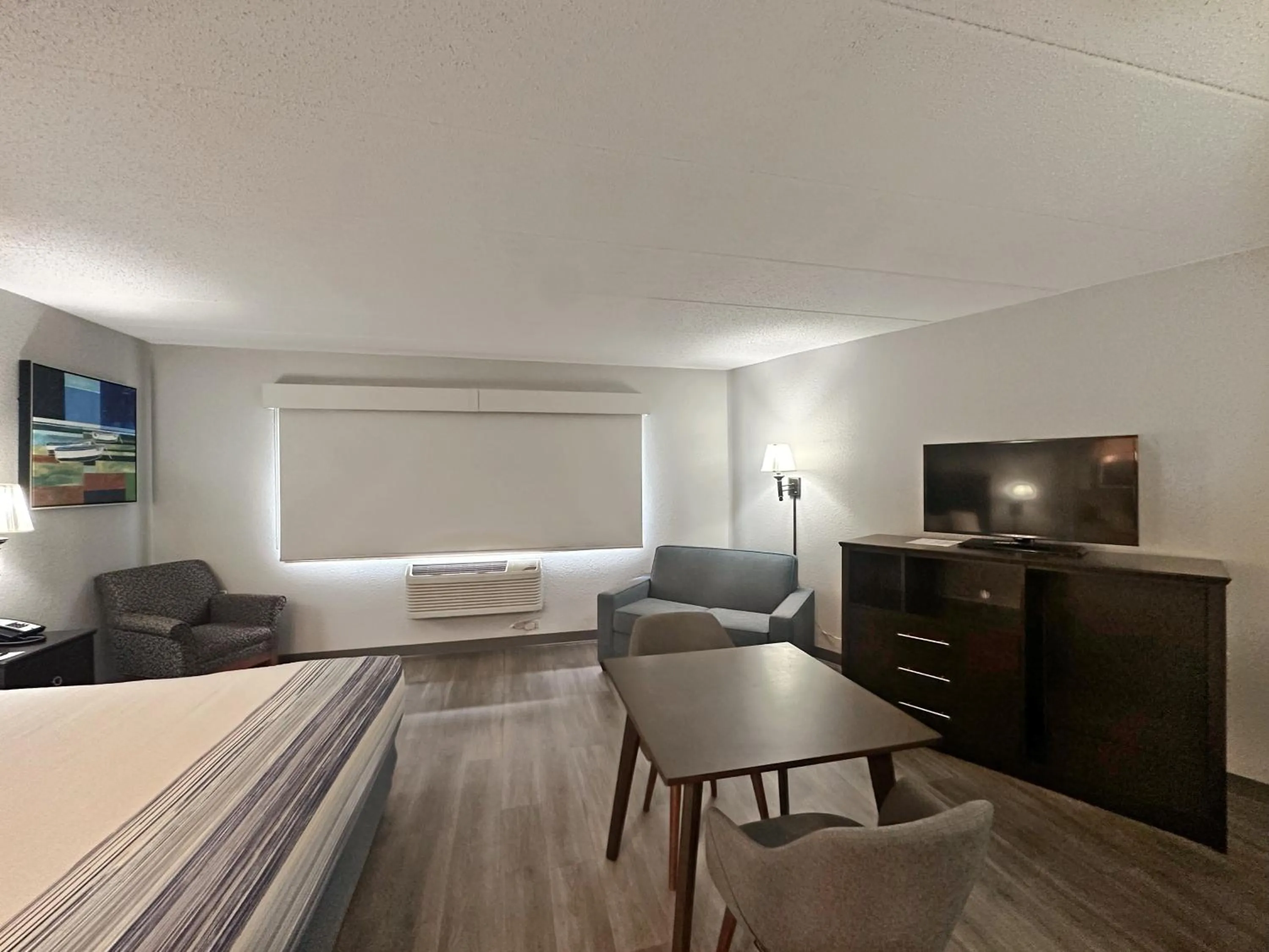 Bed in AmericInn by Wyndham Menominee