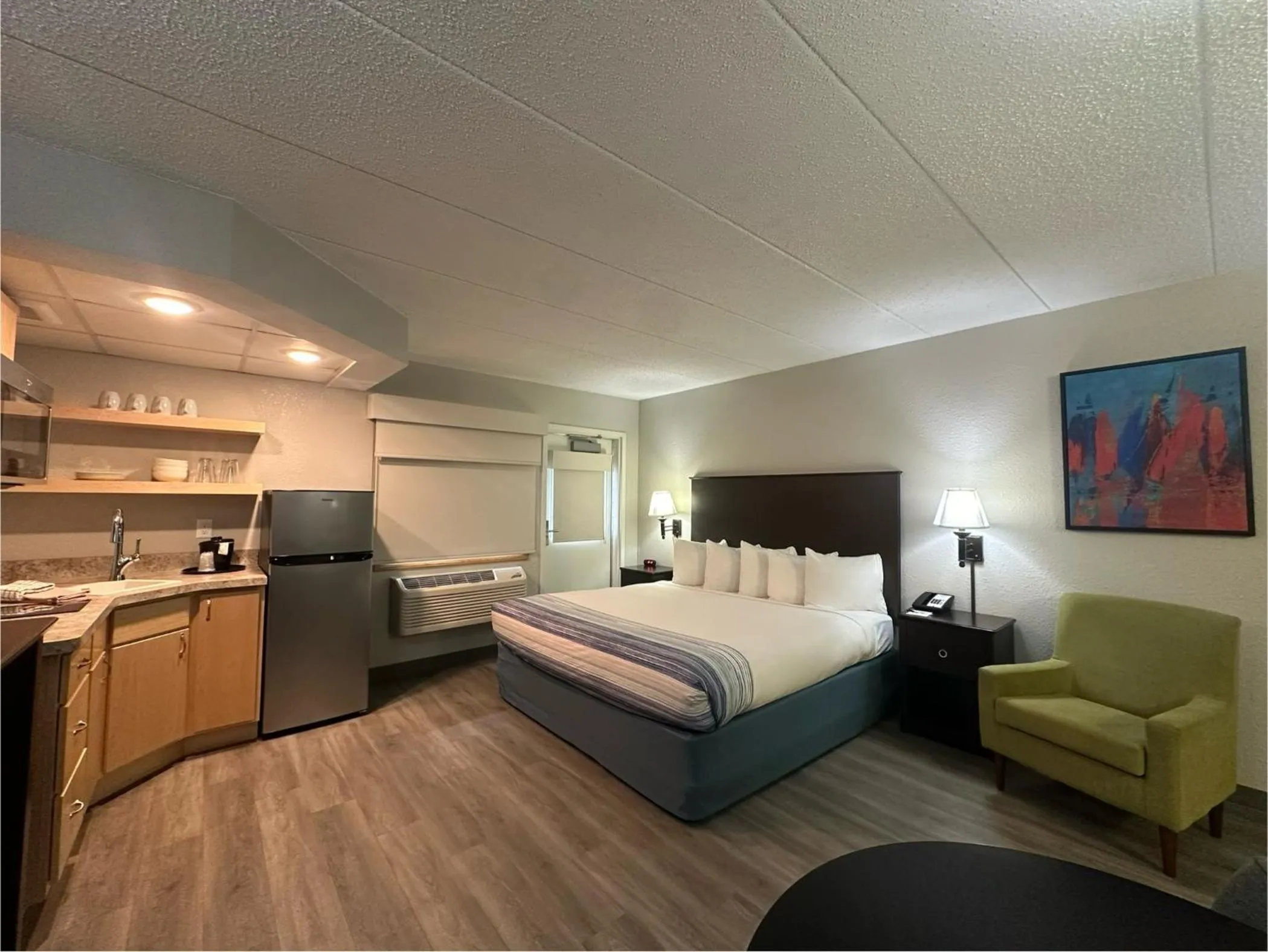Bed in AmericInn by Wyndham Menominee