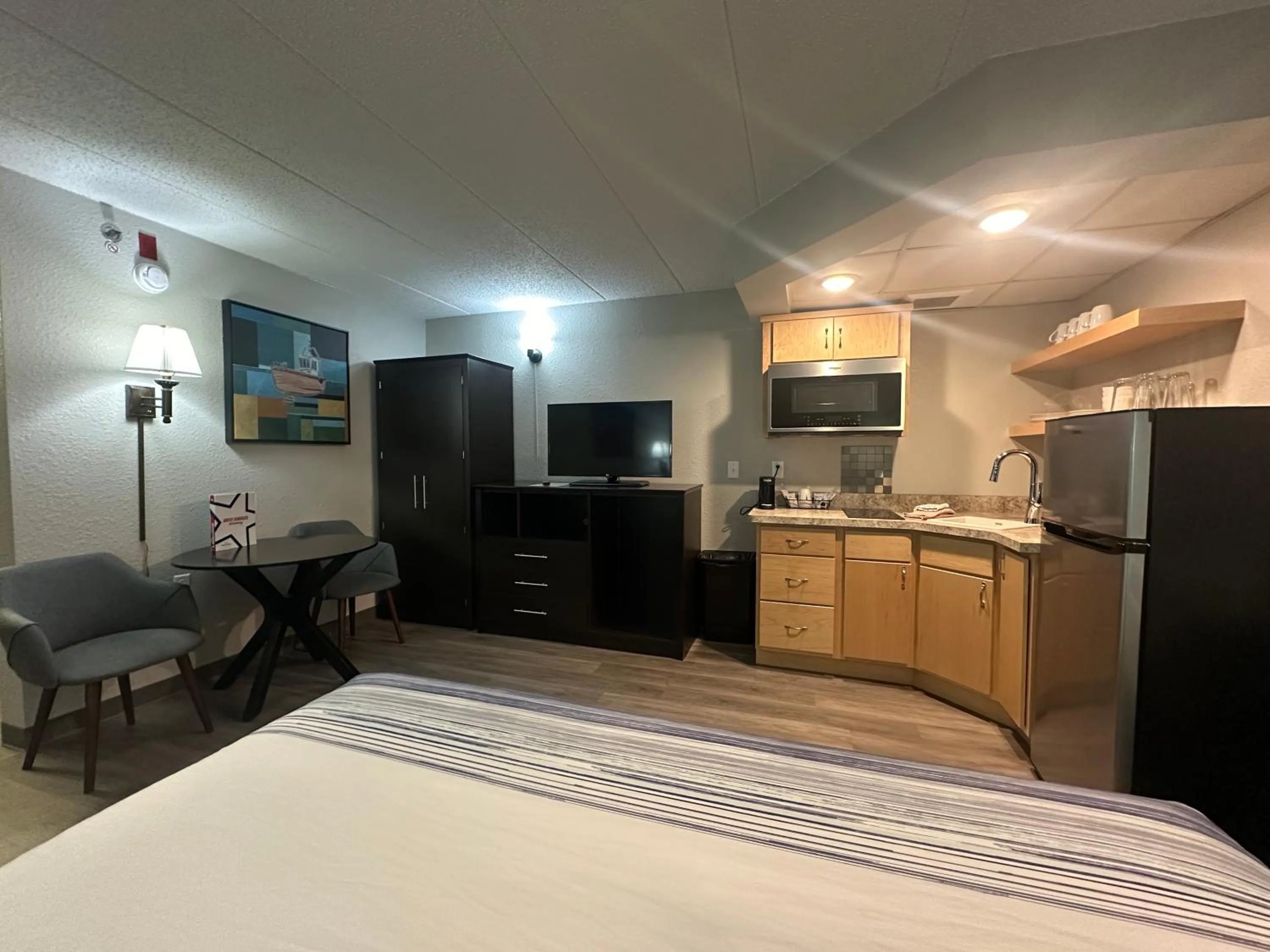 Bed in AmericInn by Wyndham Menominee