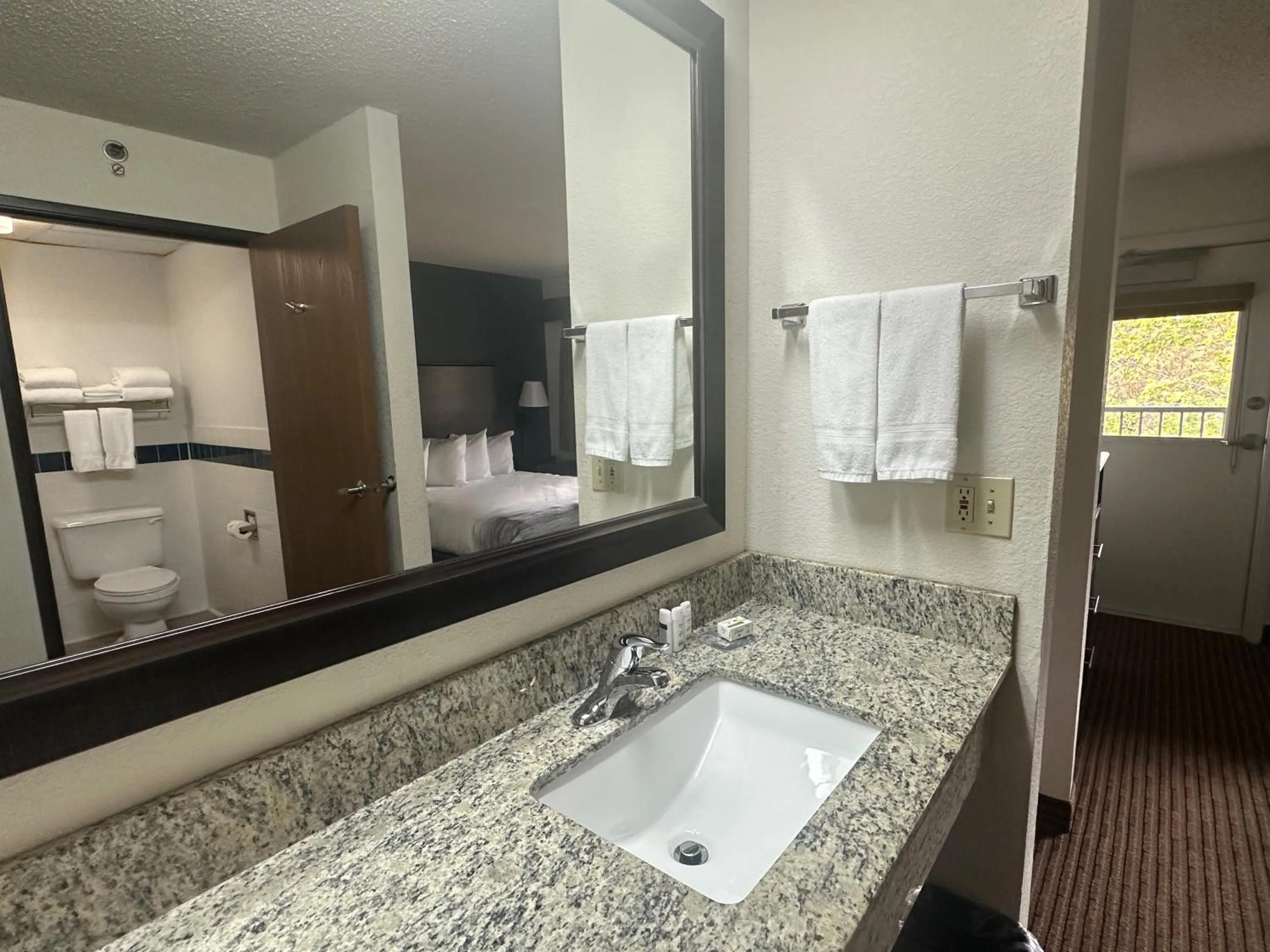 Bathroom in AmericInn by Wyndham Menominee