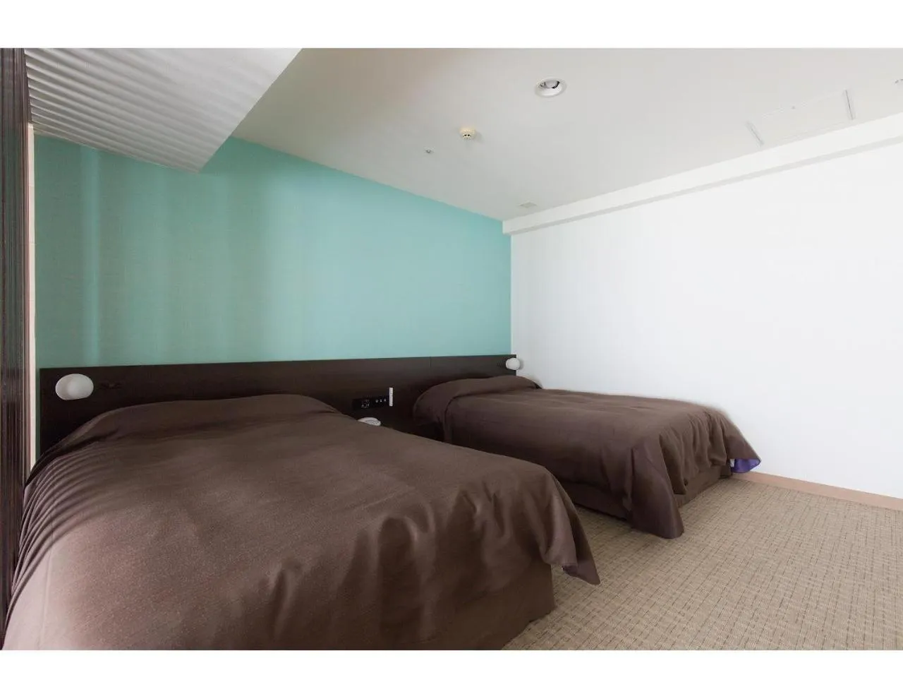 Bed in EM Wellness Kurashinohakko Lifestyle Resort