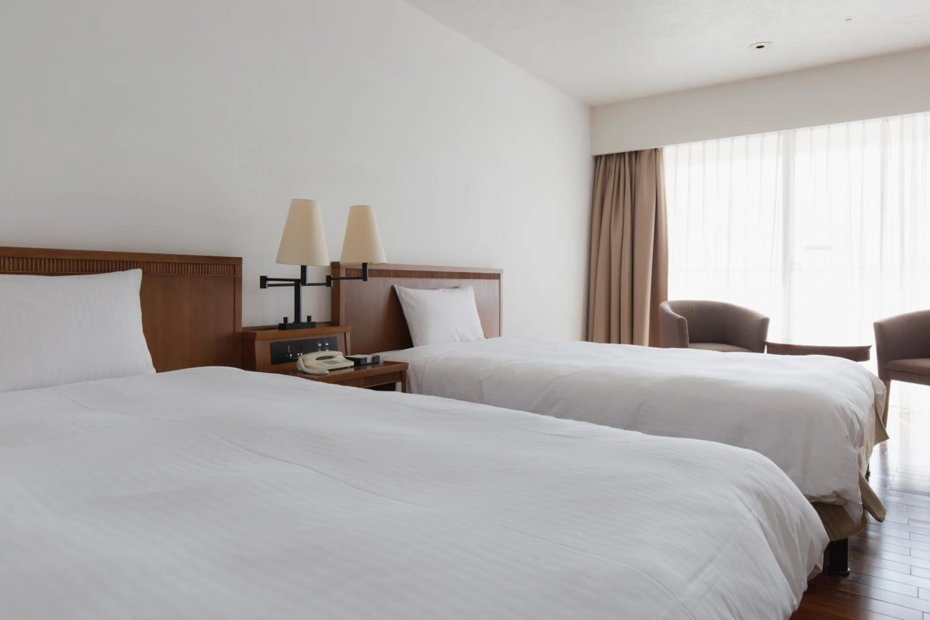 Bed in EM Wellness Kurashinohakko Lifestyle Resort