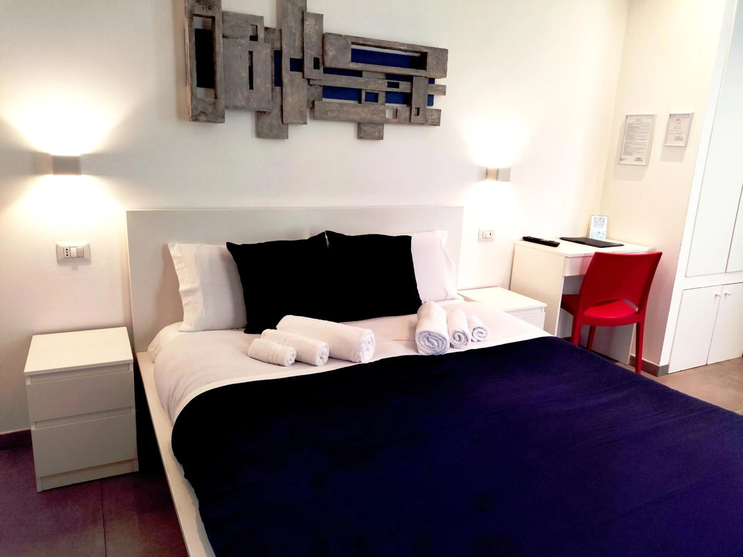 Bed in Palazzo Verdi Holiday Viterbo