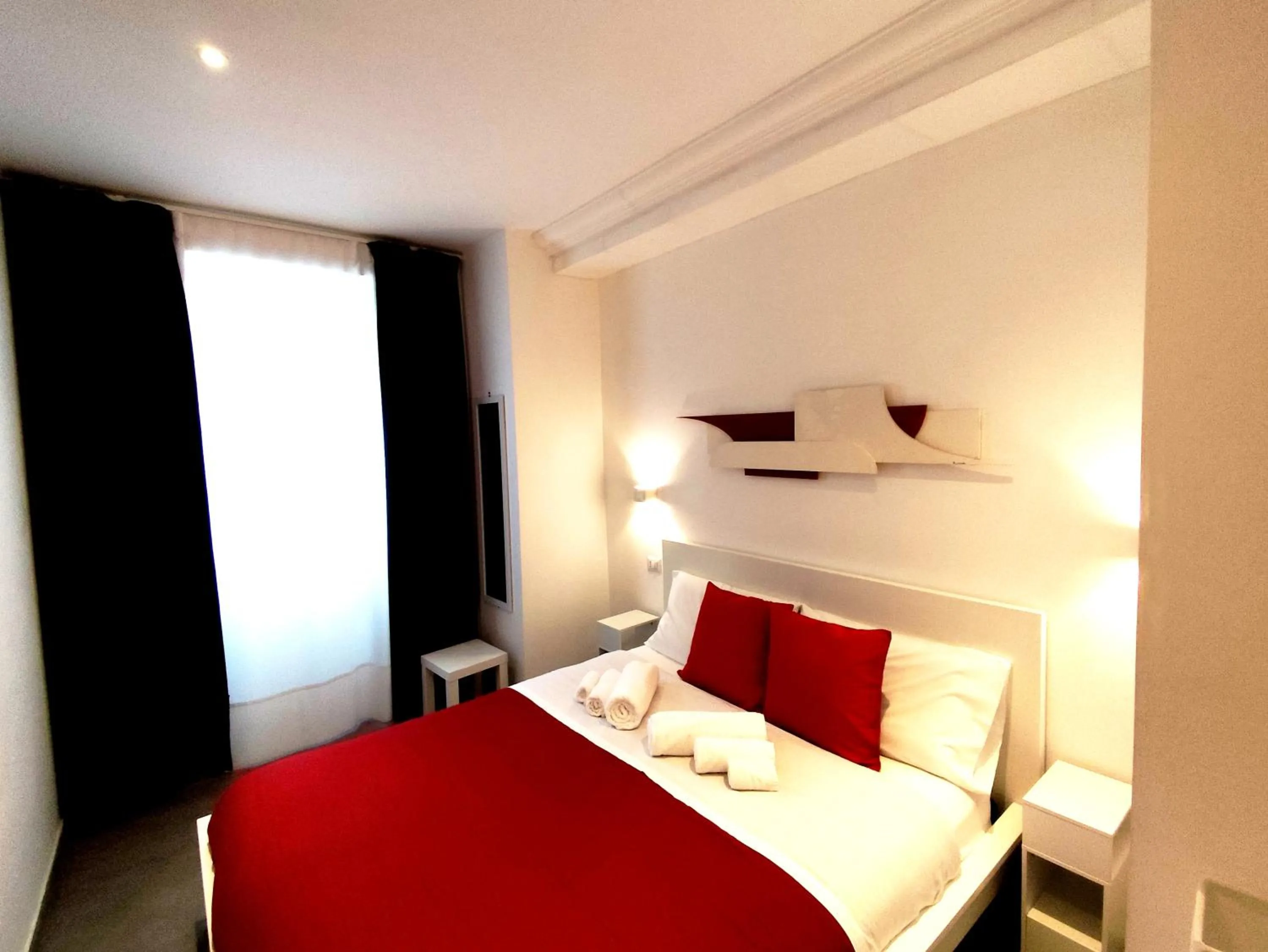 Bed in Palazzo Verdi Holiday Viterbo