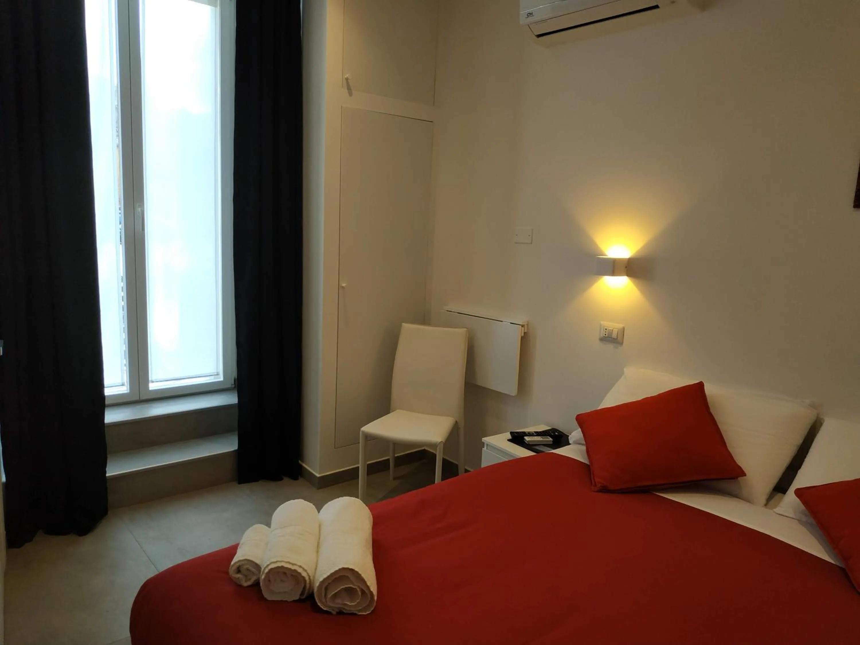 Bed in Palazzo Verdi Holiday Viterbo