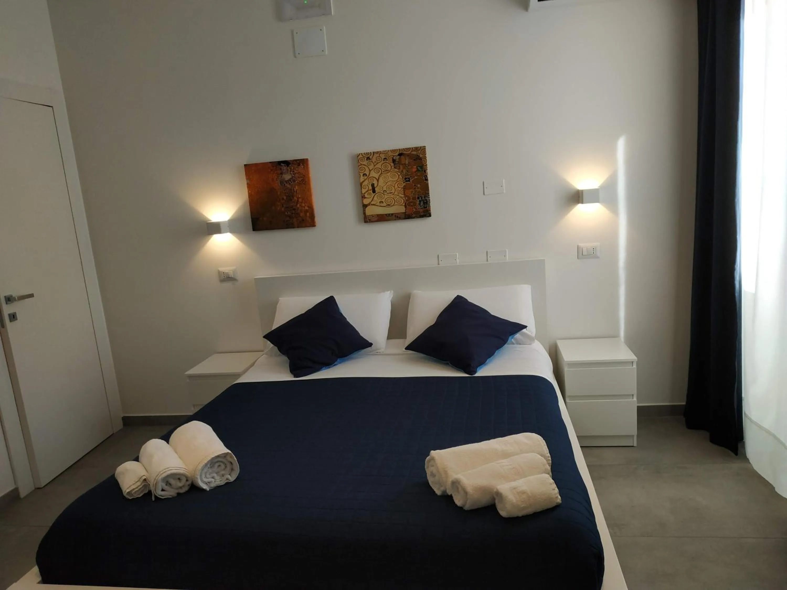 Bed in Palazzo Verdi Holiday Viterbo