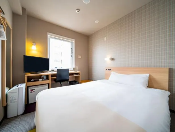 Bed in Super Hotel Takamatsu Kin en kan