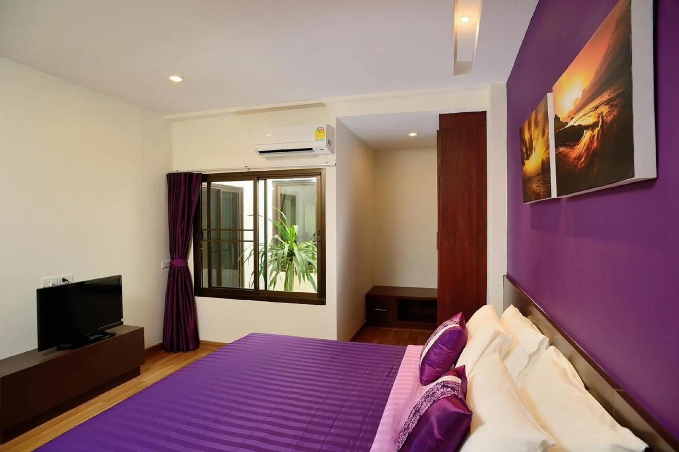 Bed in Kamala Beachfront Apartment