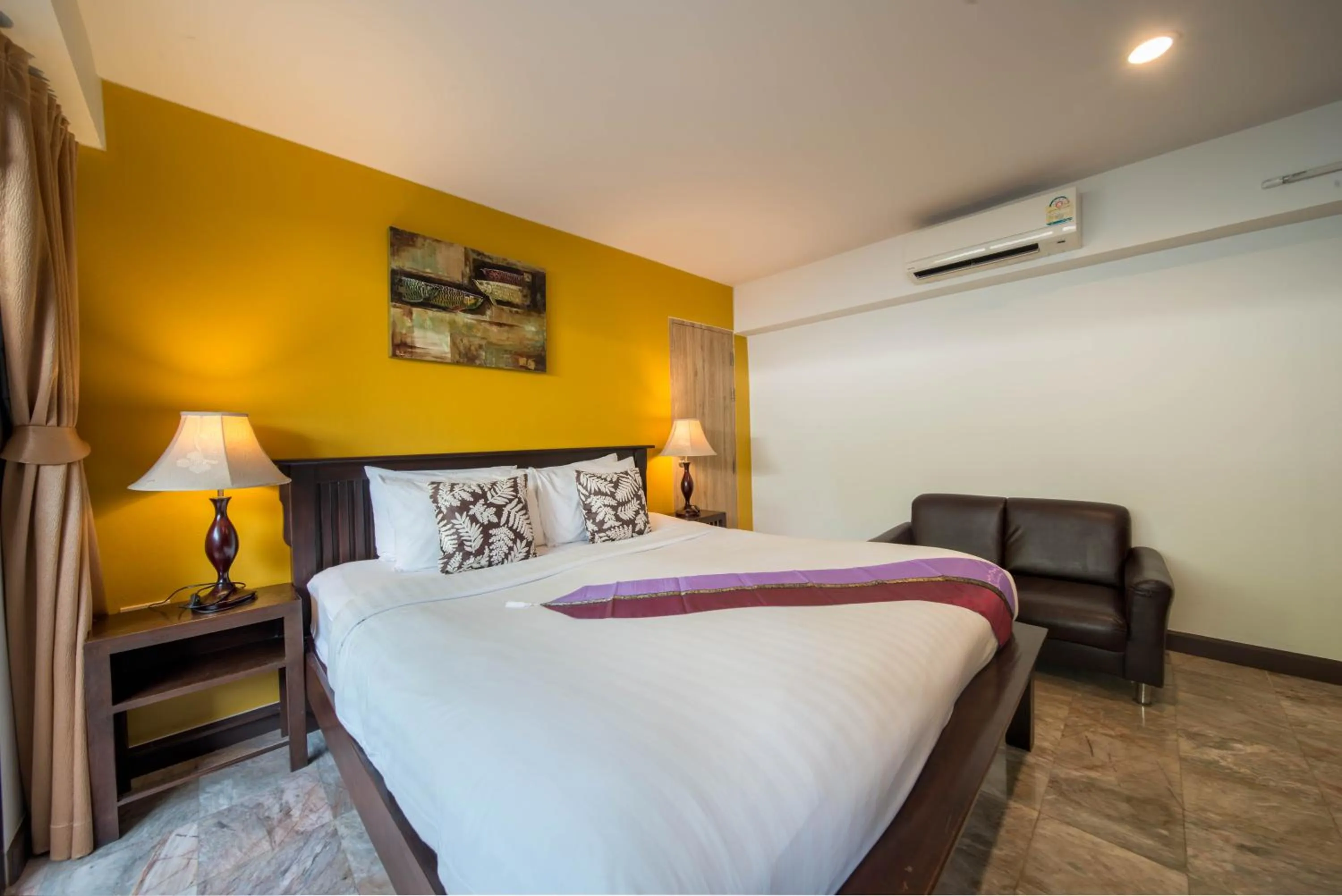 Bed in Kamala Beachfront Apartment