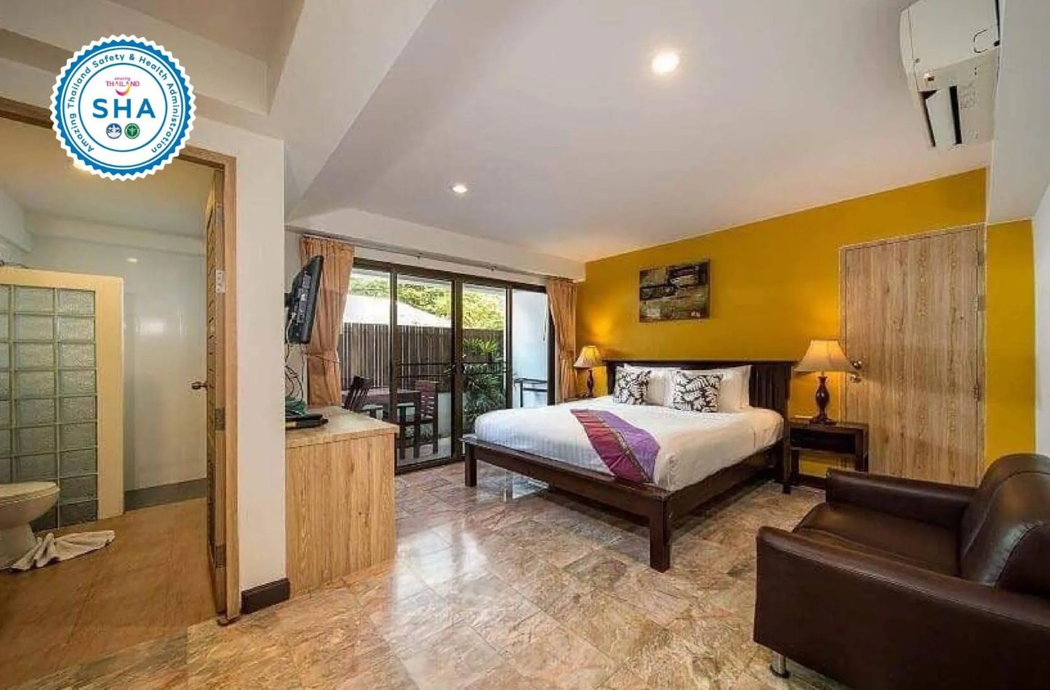 Bed in Kamala Beachfront Apartment