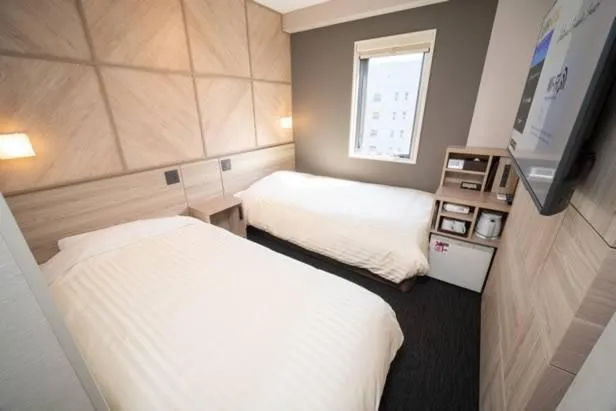 Bed in Super Hotel Niihama