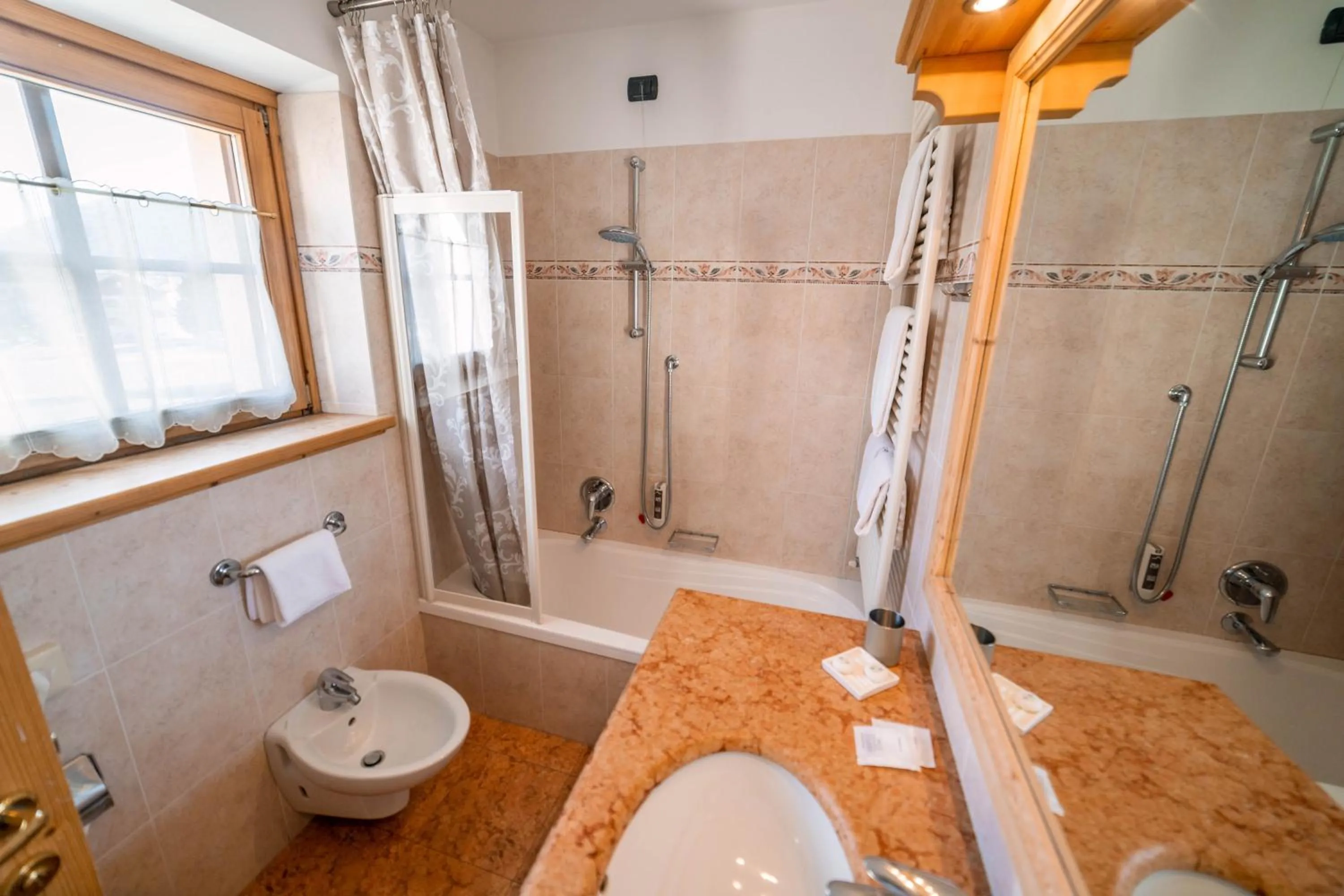 Bathroom in Alpi & Golf Hotel