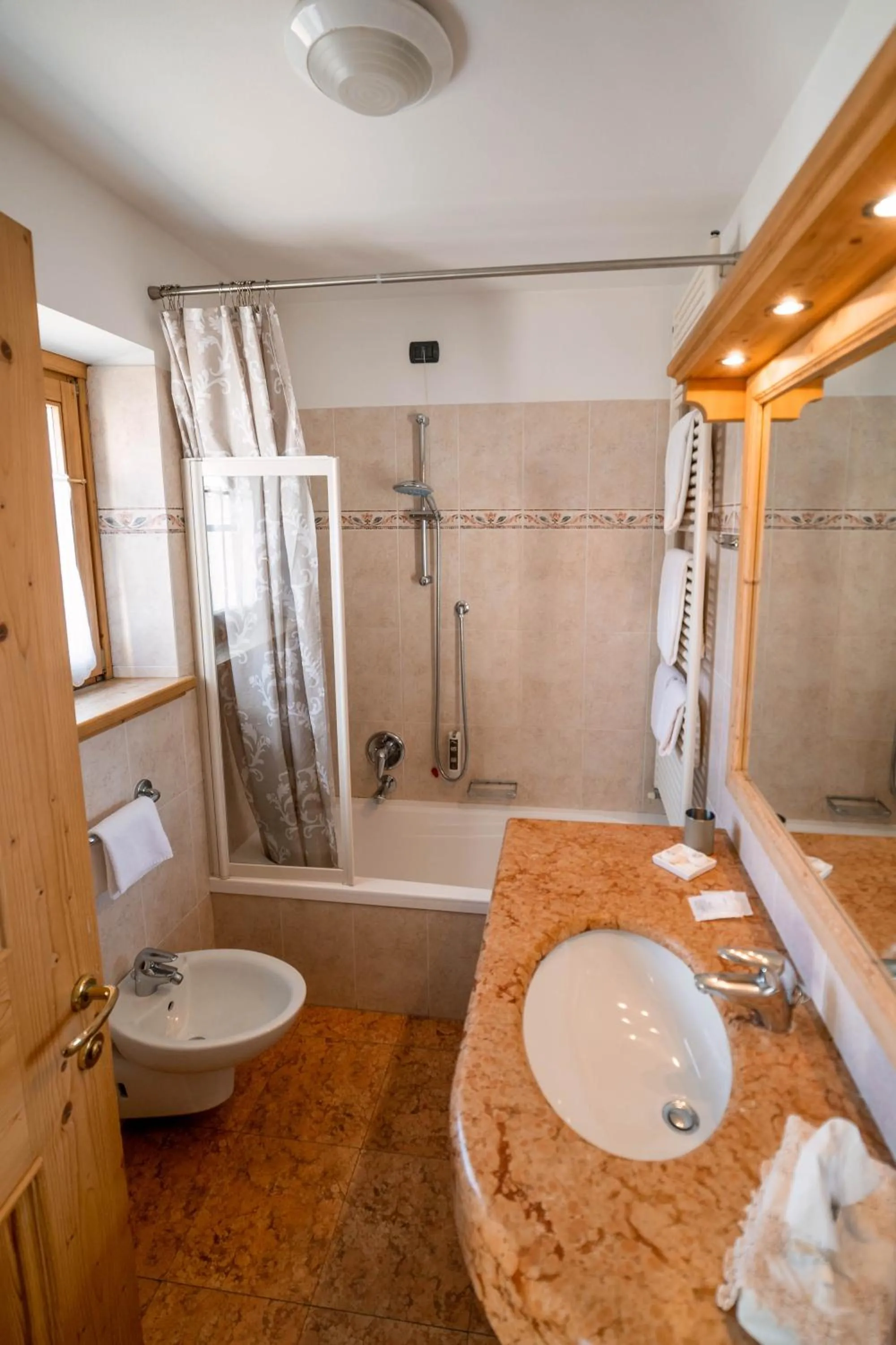 Bathroom in Alpi & Golf Hotel