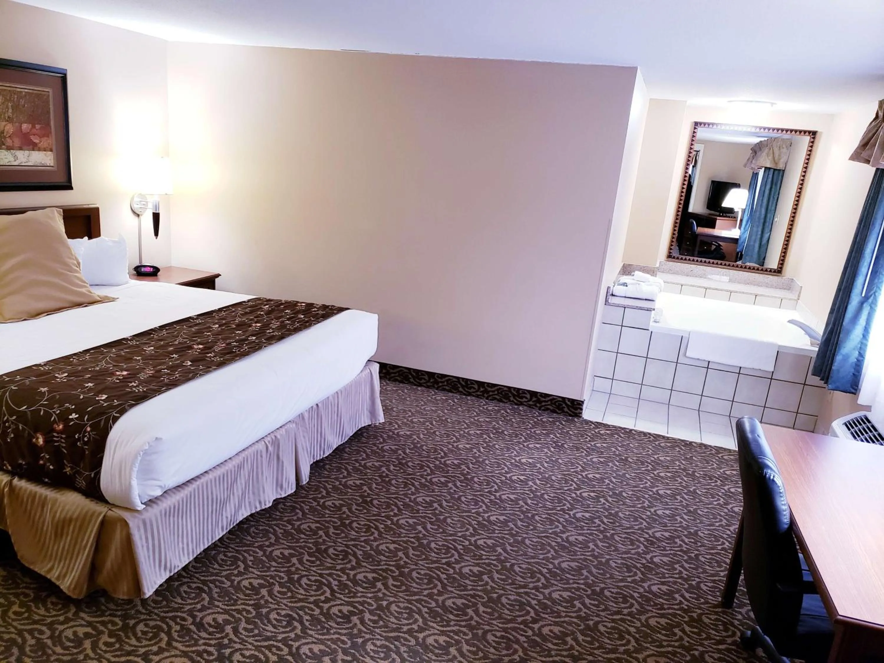Photo of the whole room, Bed in SureStay Plus Hotel by Best Western Black River Falls