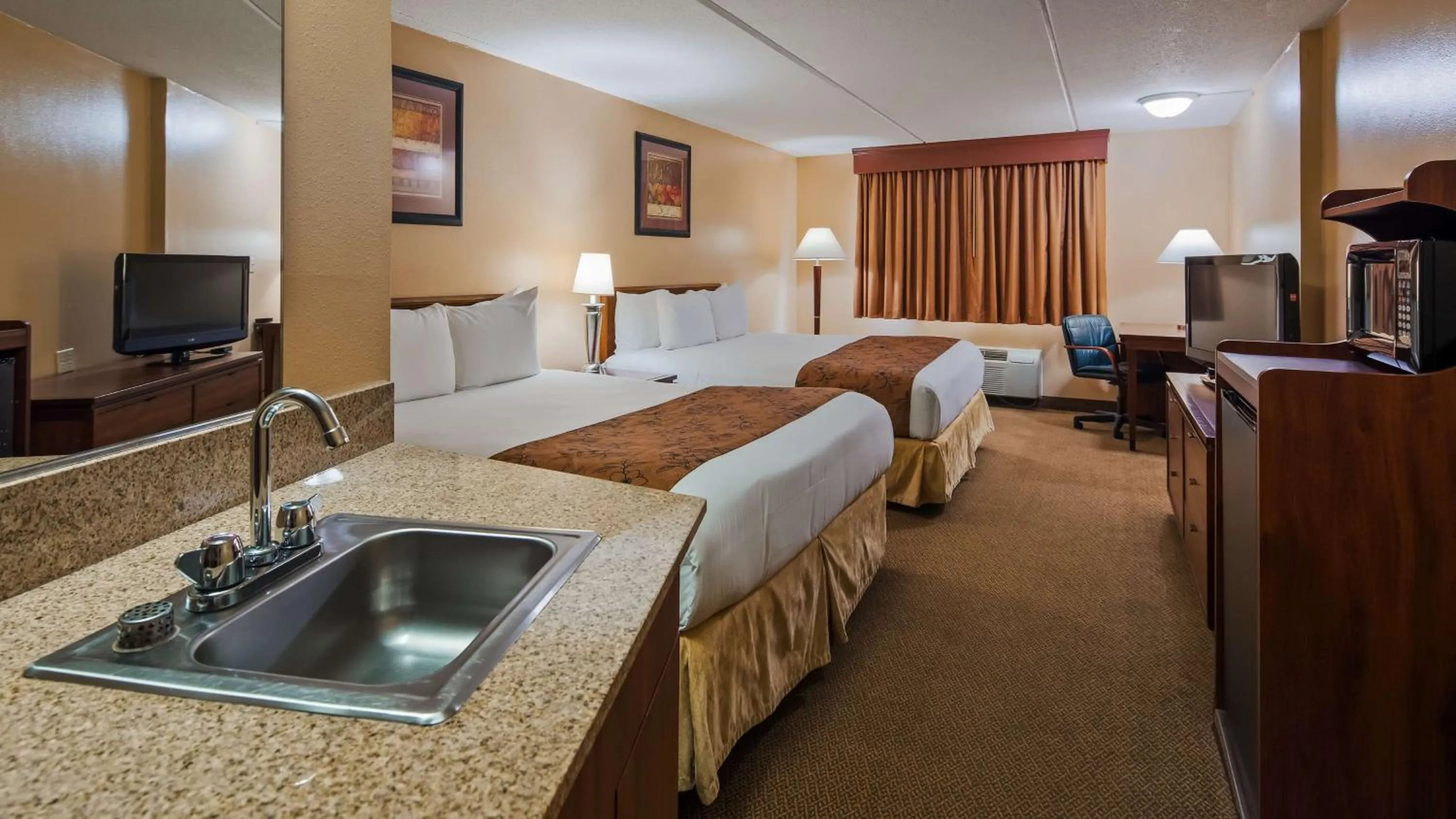 Photo of the whole room, Bed in SureStay Plus Hotel by Best Western Black River Falls