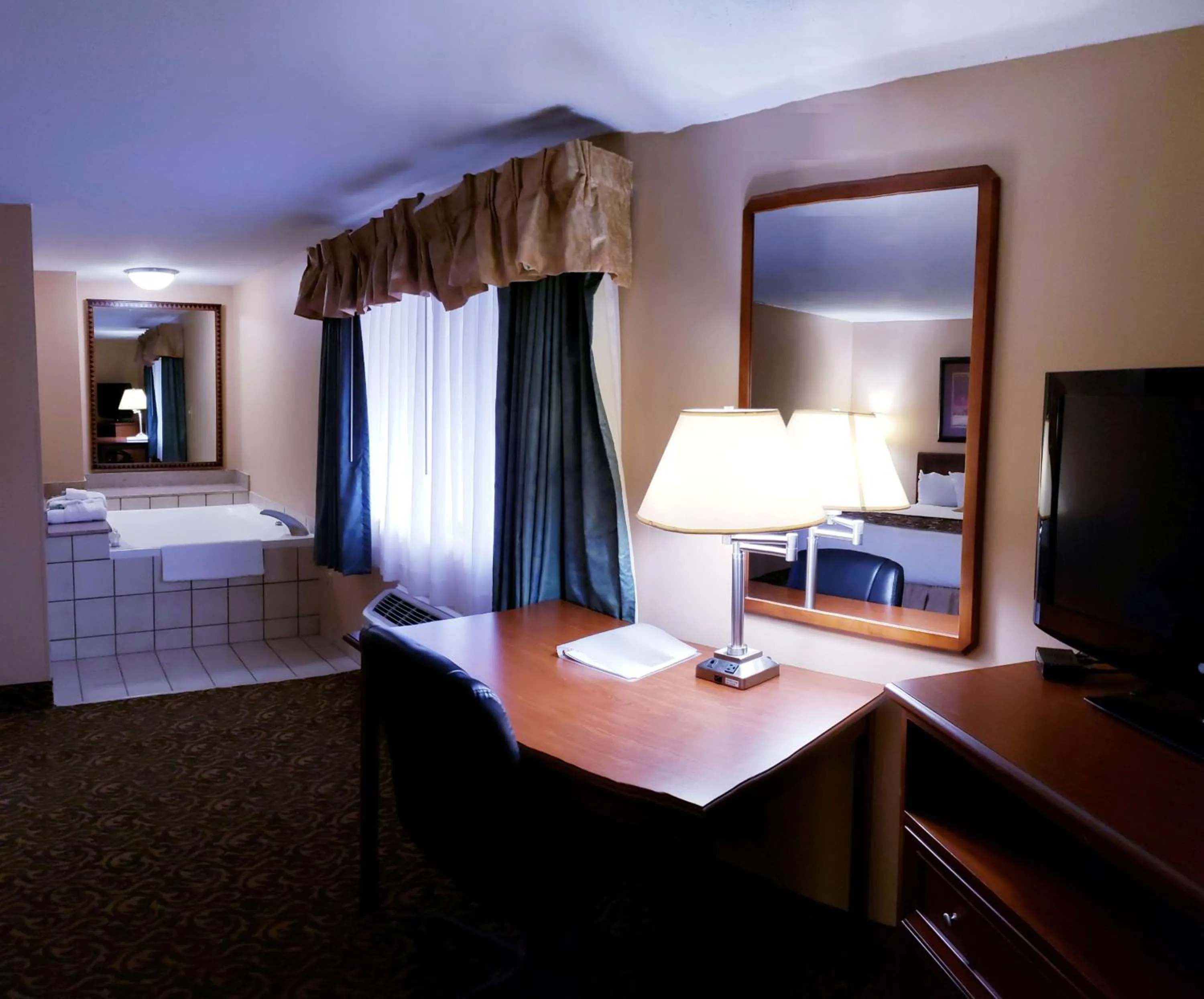 Photo of the whole room, Bed in SureStay Plus Hotel by Best Western Black River Falls