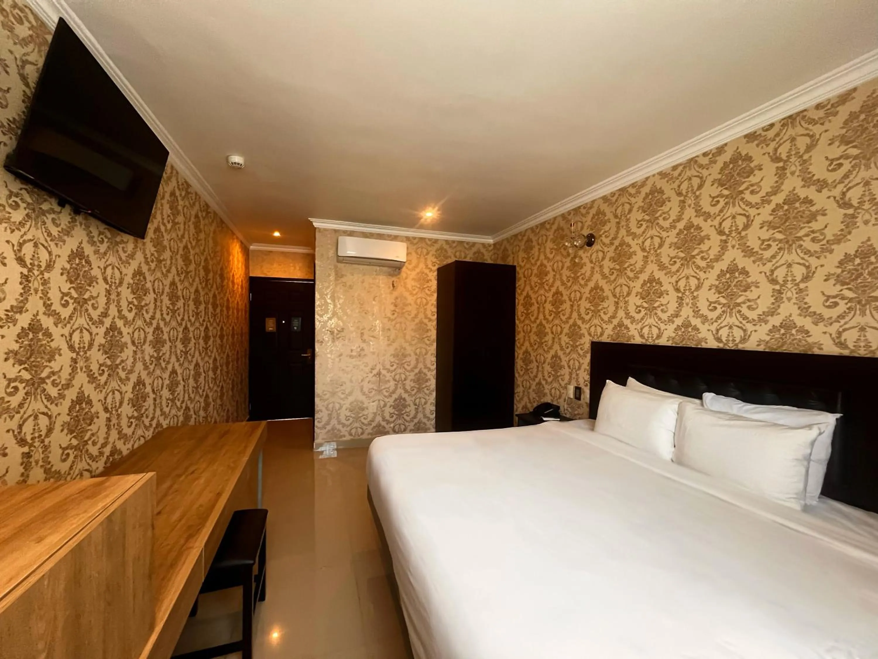 Bed in Hotel Palacio Maya