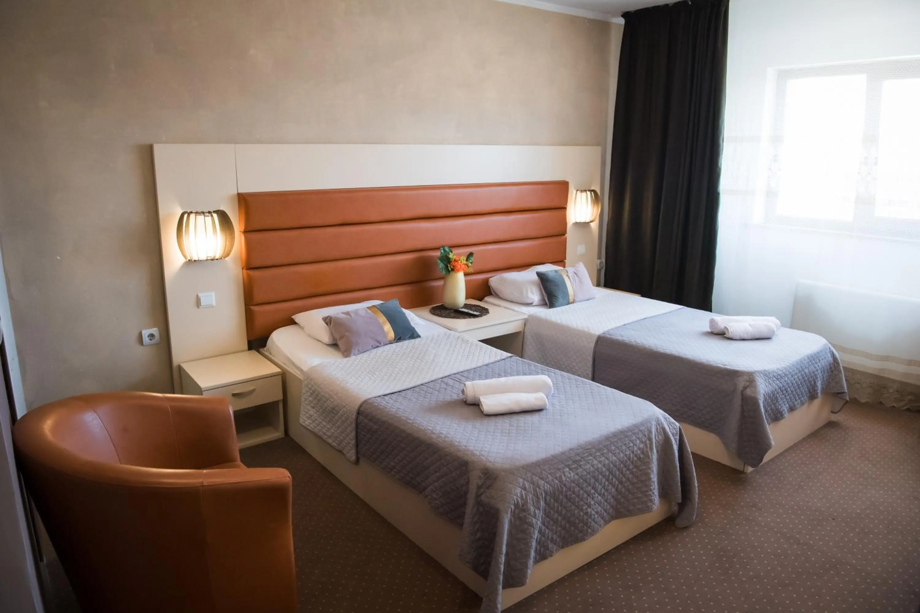 Bed in MBI Travel Inn