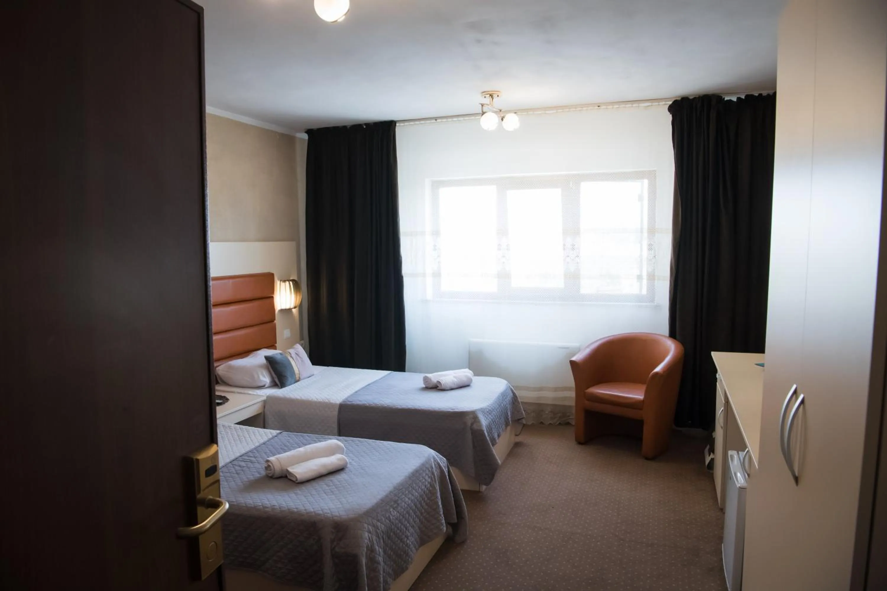 Bed in MBI Travel Inn