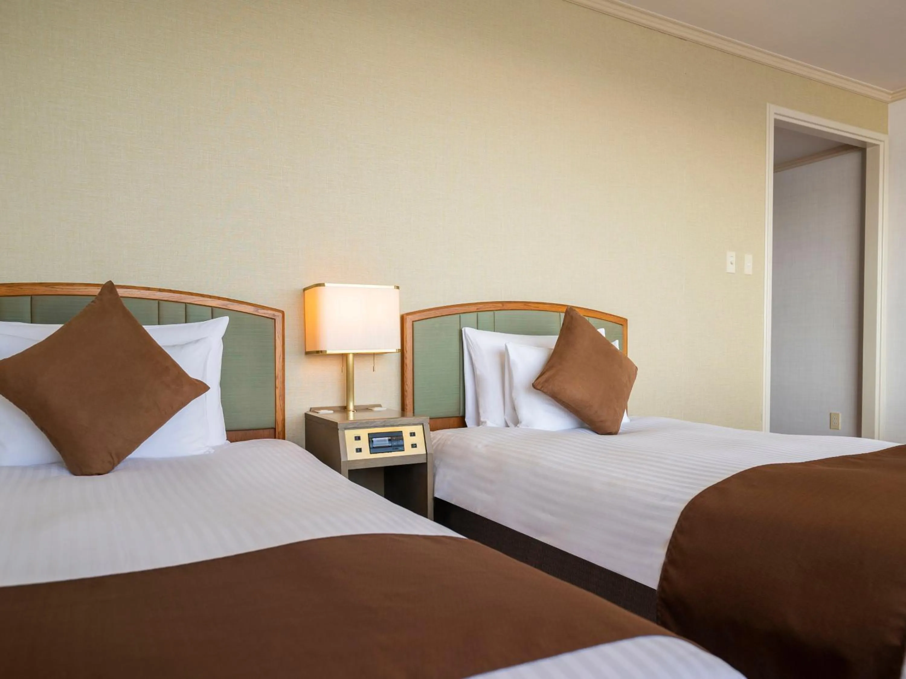 Bed in Hotel New Akao