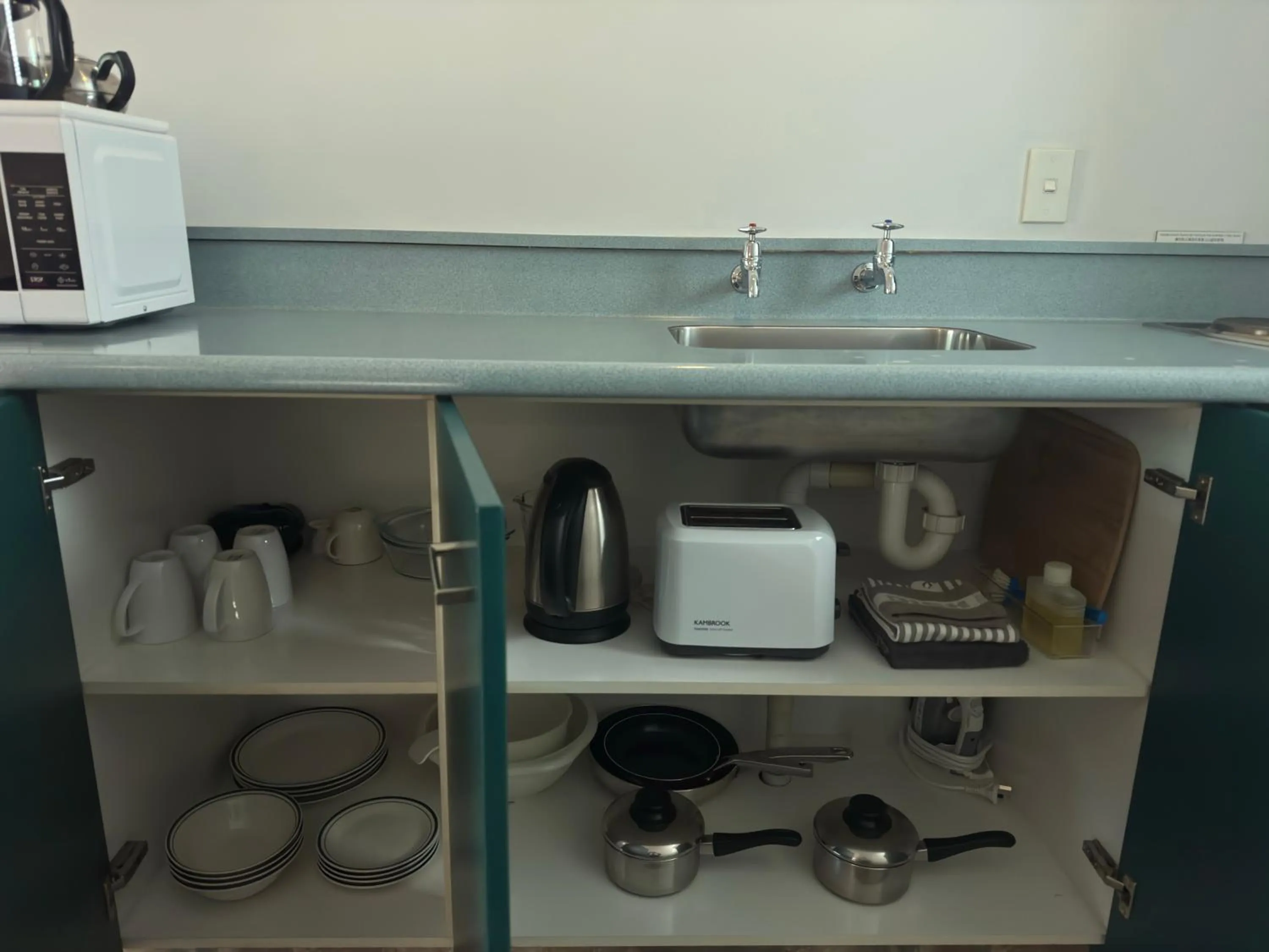 kitchen in ASURE Ambassador Motor Lodge