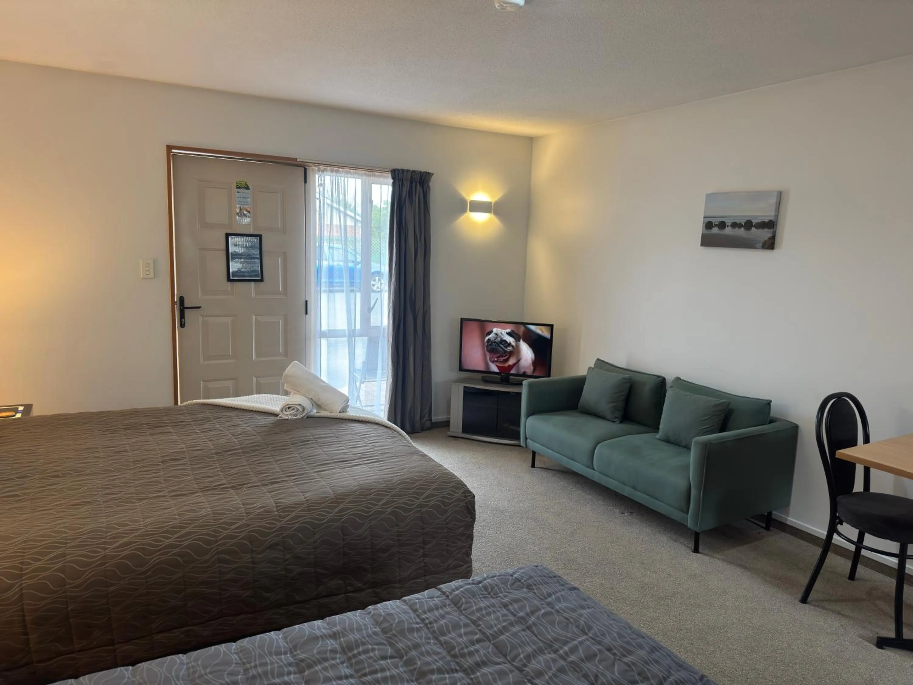 Bed in ASURE Ambassador Motor Lodge