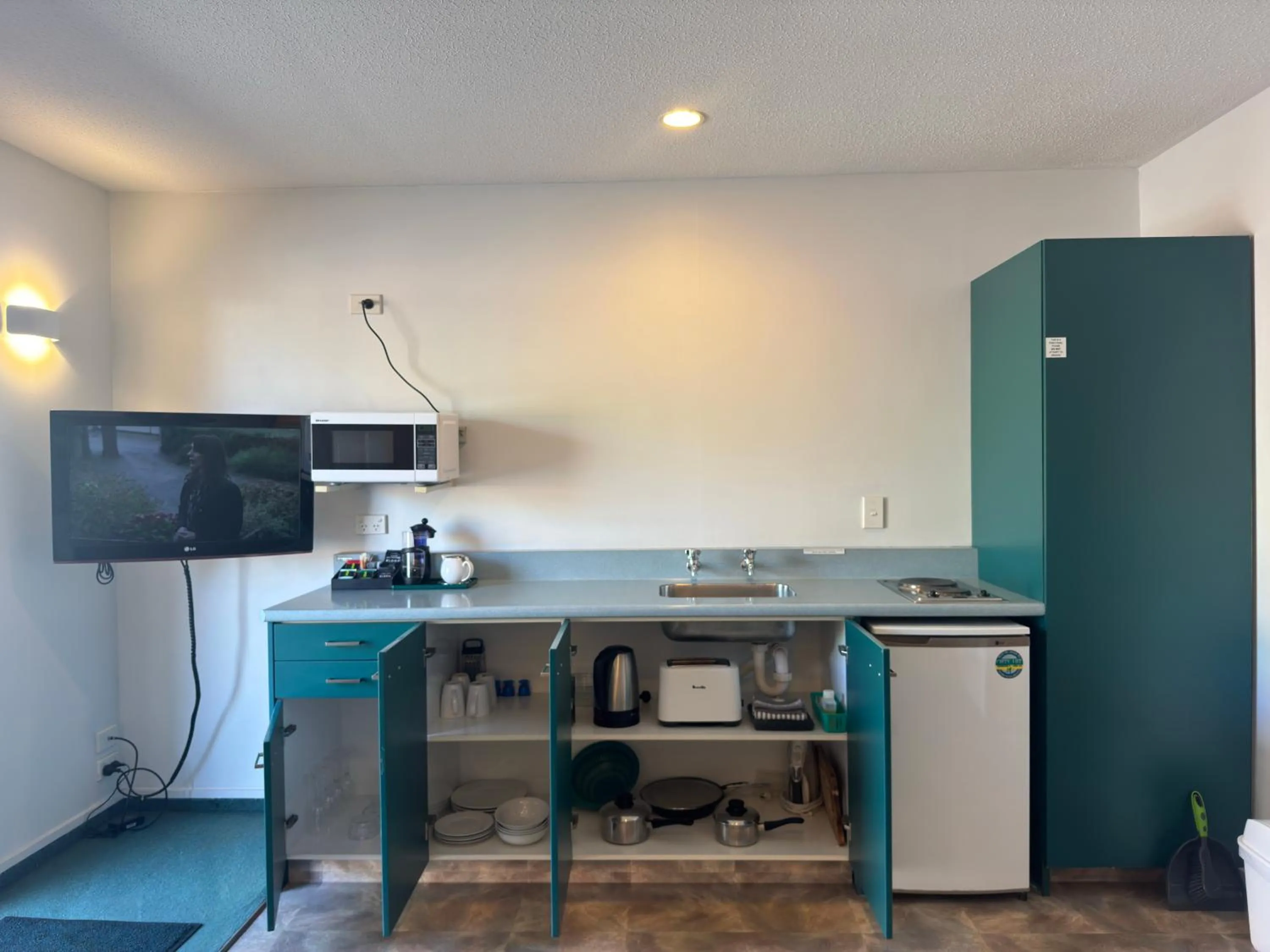 kitchen in ASURE Ambassador Motor Lodge