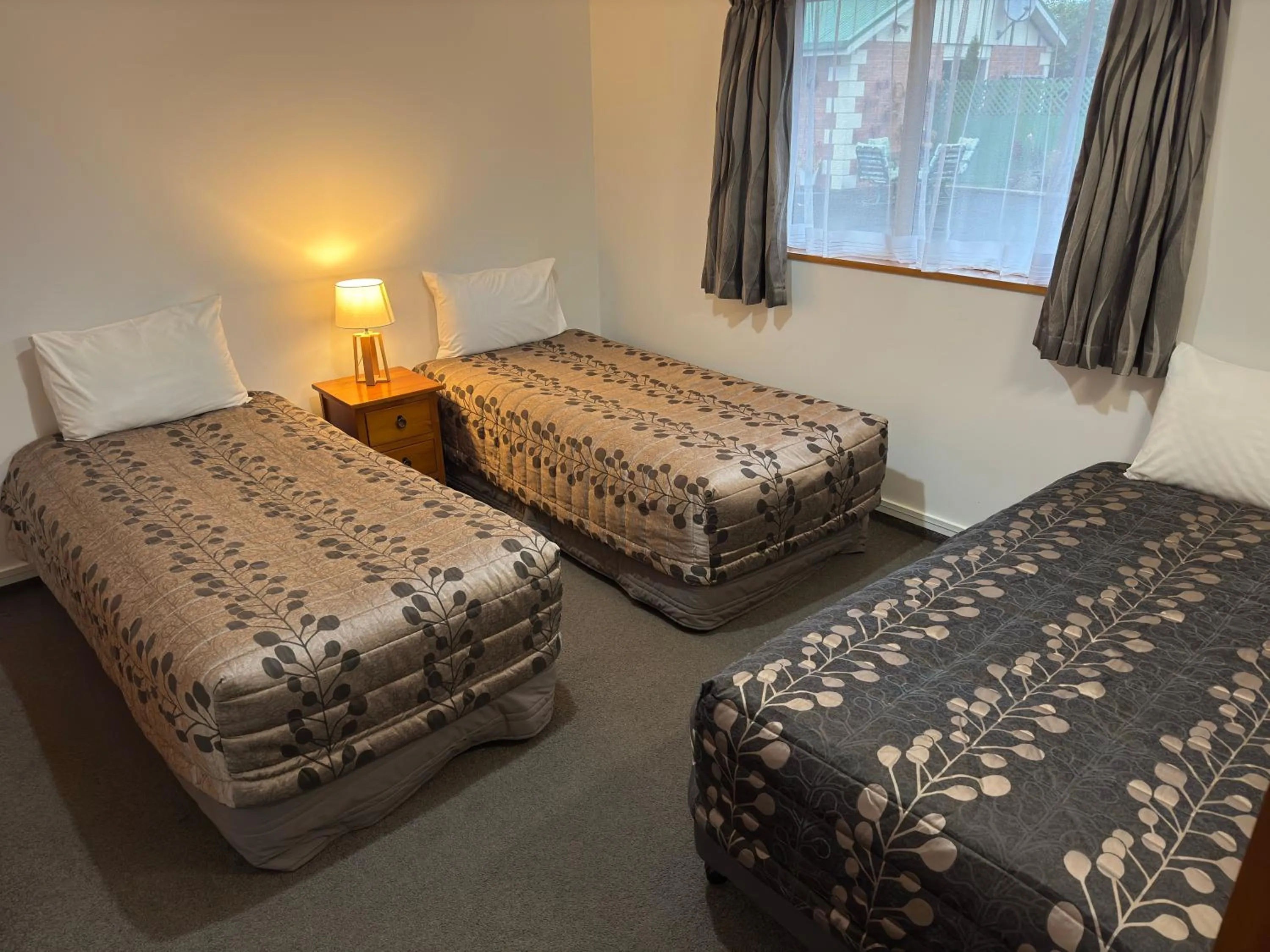 Bedroom, Bed in ASURE Ambassador Motor Lodge