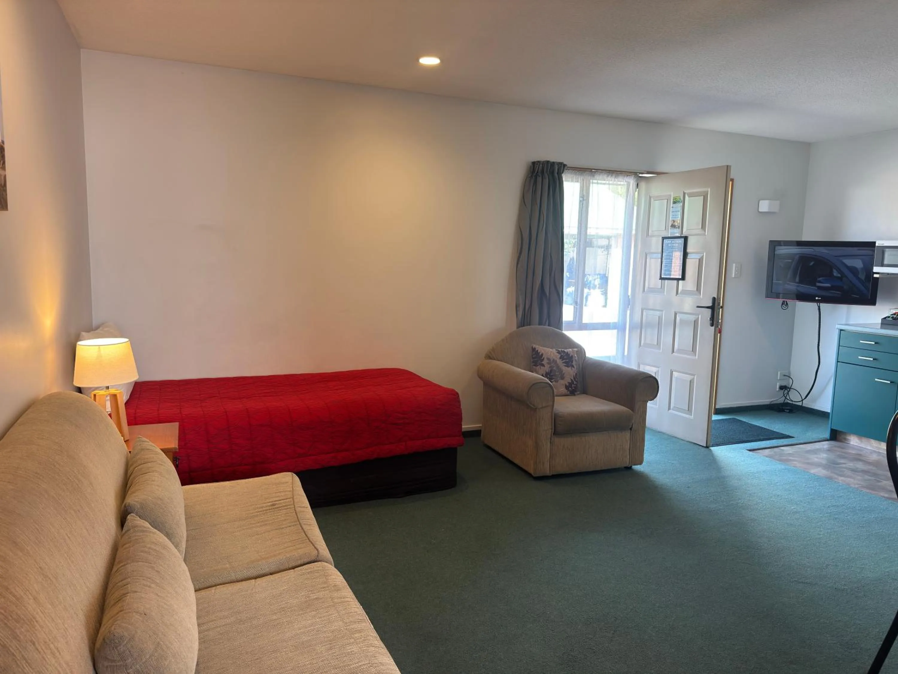 Living room in ASURE Ambassador Motor Lodge