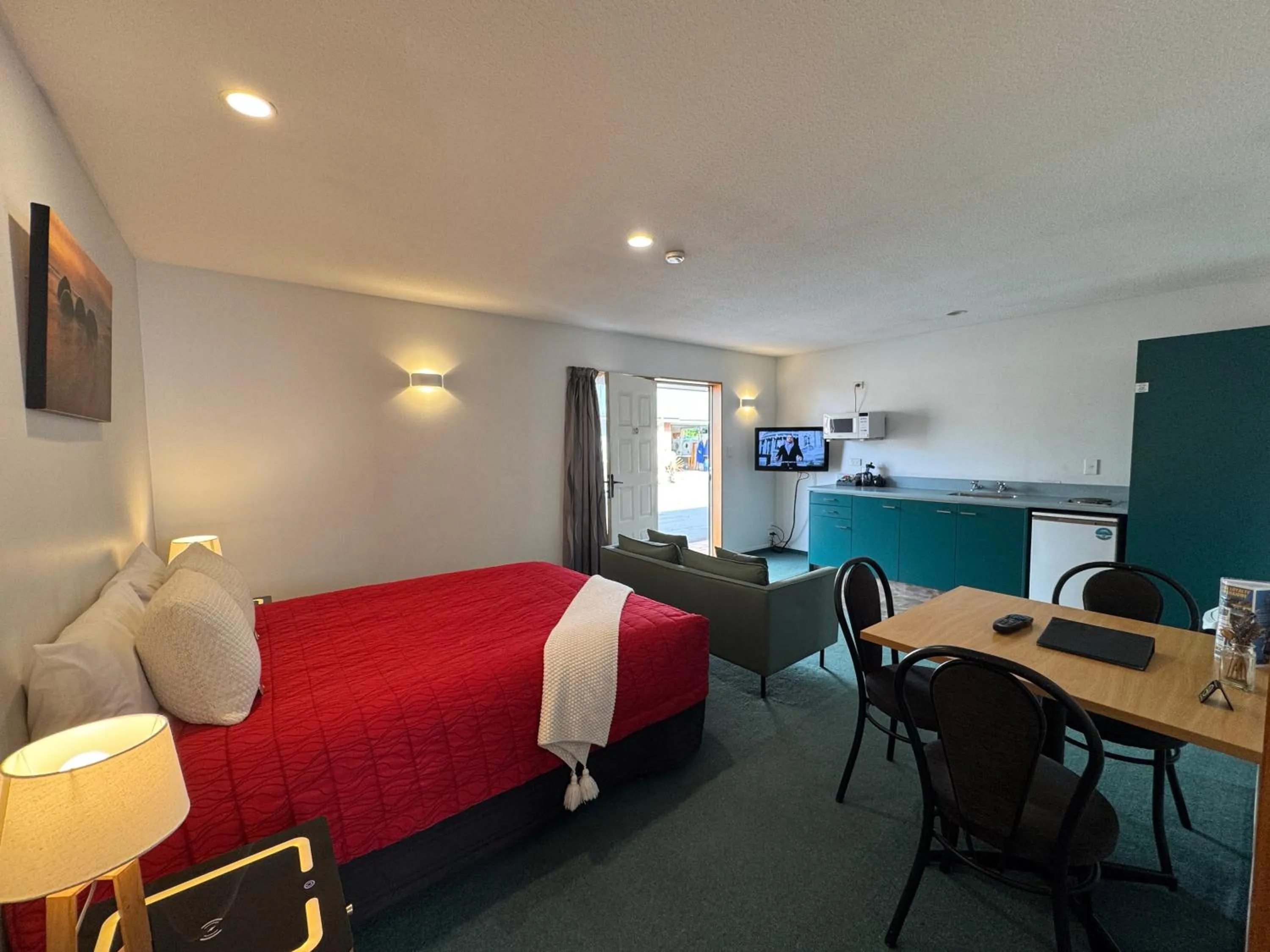 Bed in ASURE Ambassador Motor Lodge