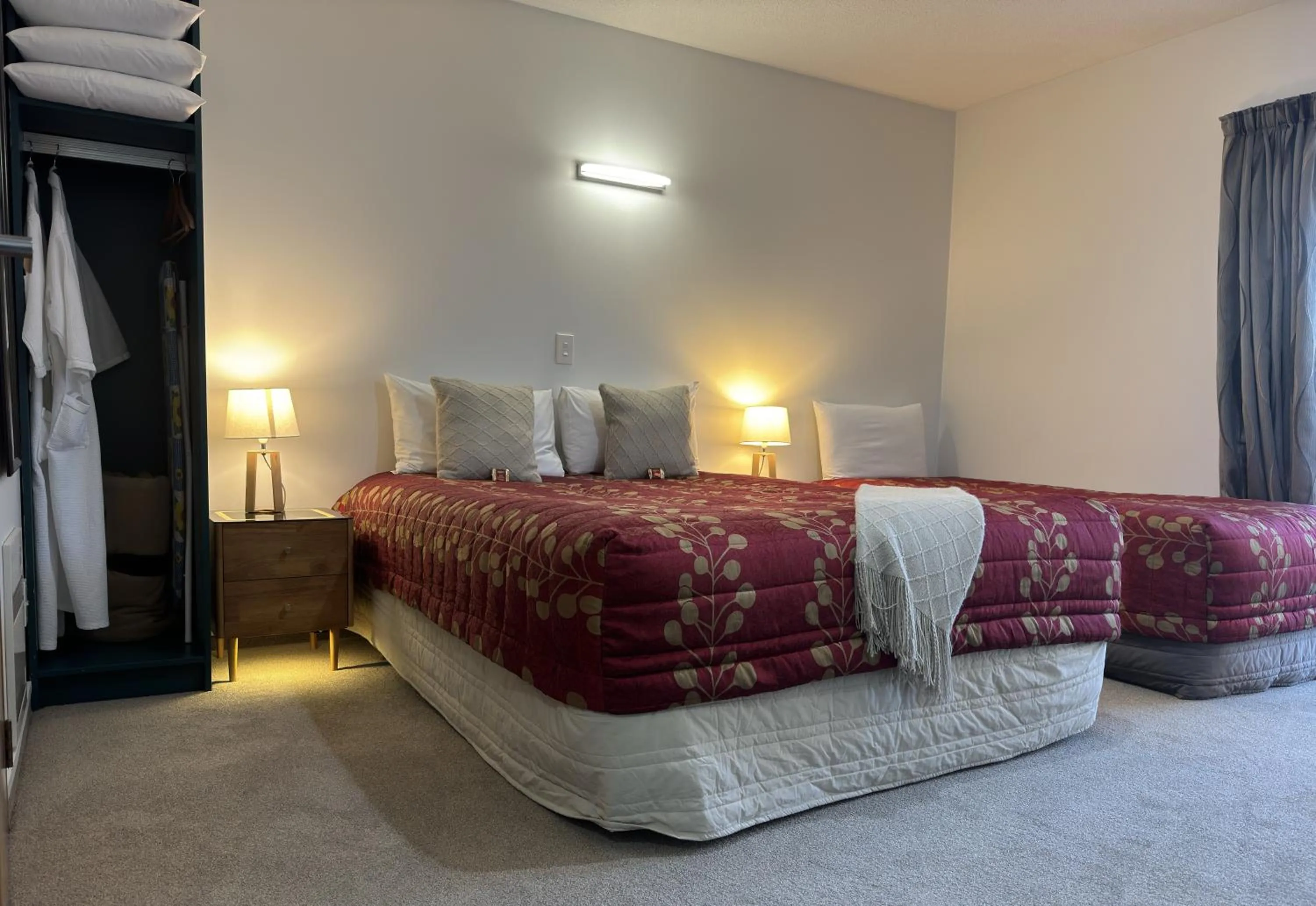 Bed in ASURE Ambassador Motor Lodge