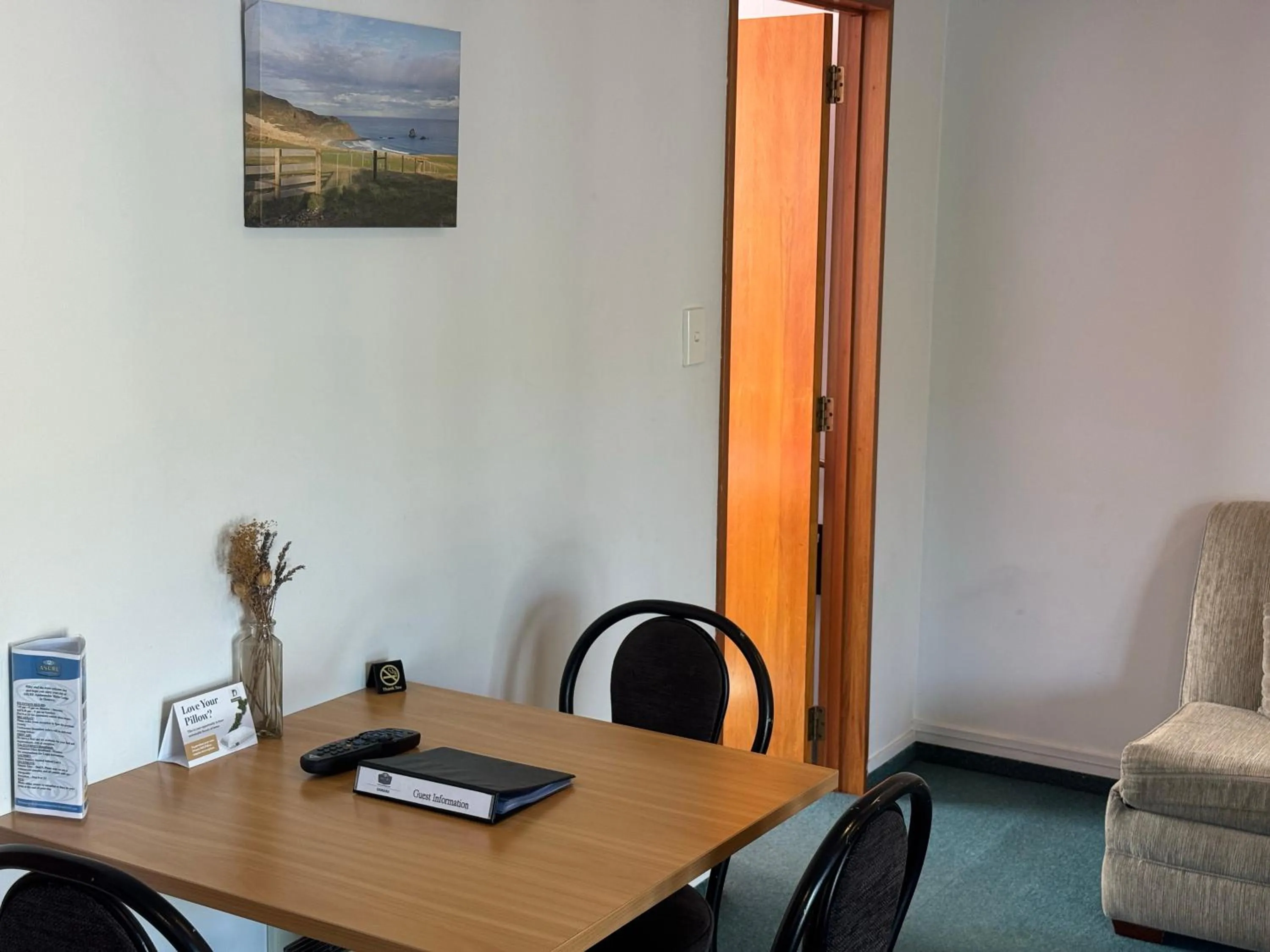 Living room in ASURE Ambassador Motor Lodge