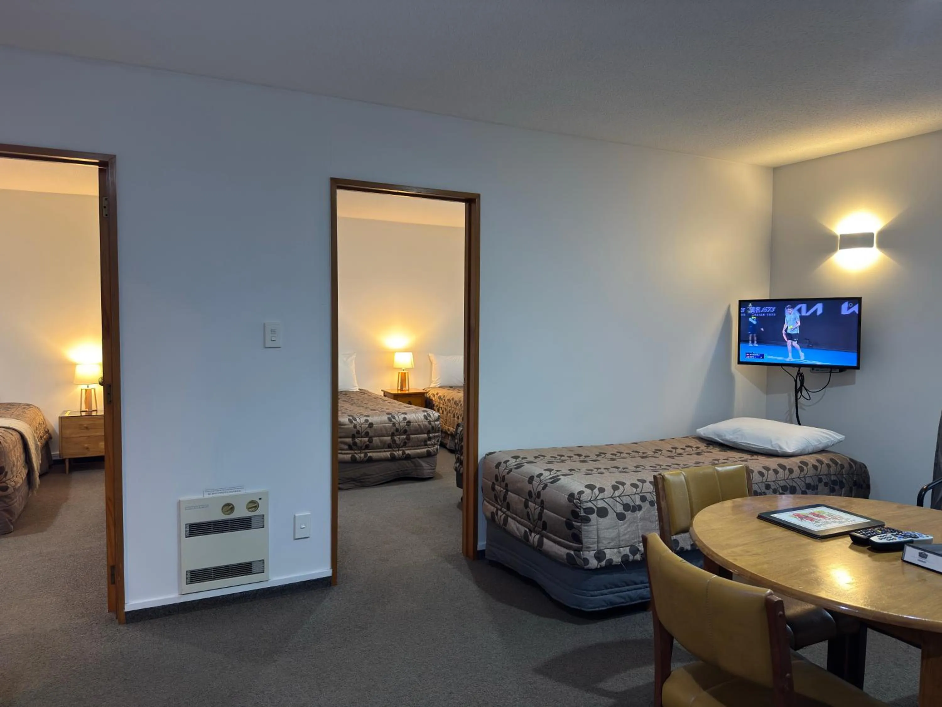 Bed in ASURE Ambassador Motor Lodge