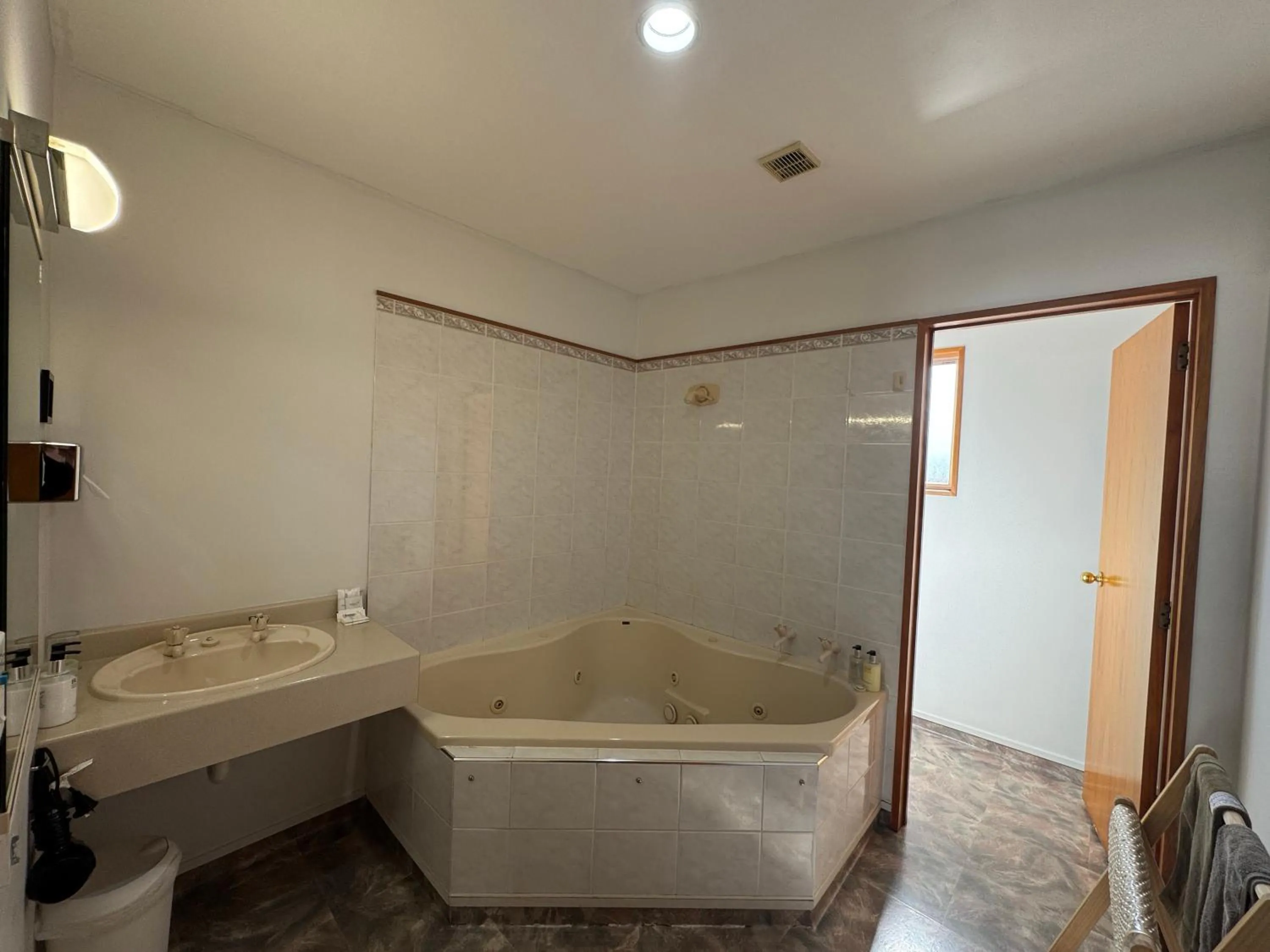 Bathroom in ASURE Ambassador Motor Lodge