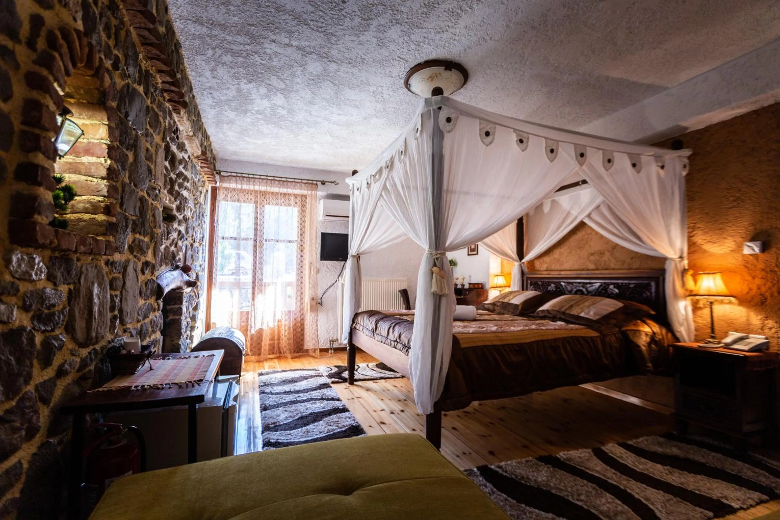 Bed in La Moara Boutique Hotel